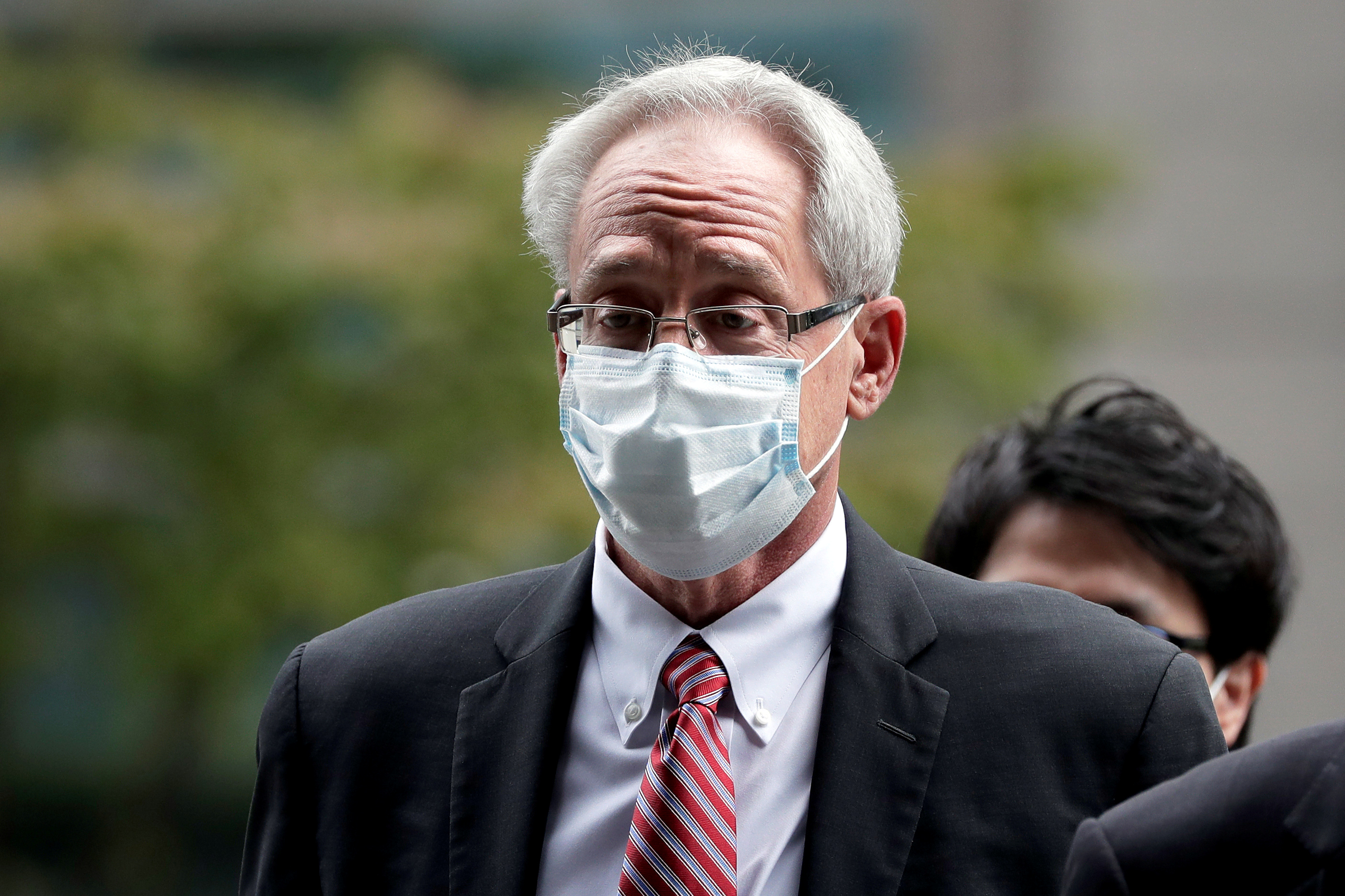 Greg Kelly, former representative director of Nissan Motor Co., arrives for the first trial hearing at the Tokyo District Court in Tokyo