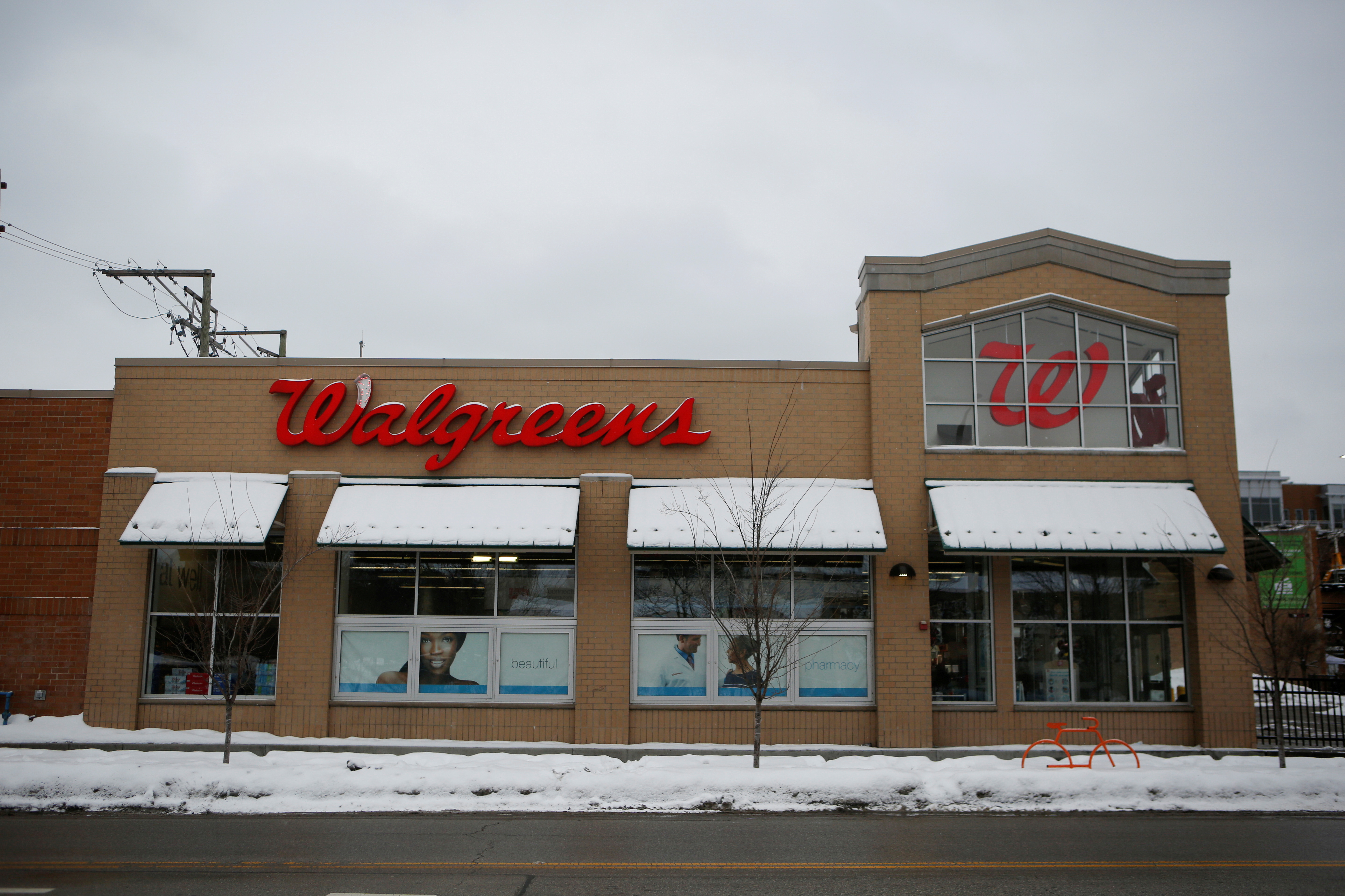 People are inoculated against the coronavirus disease (COVID-19) at a Walgreens store in Chicago