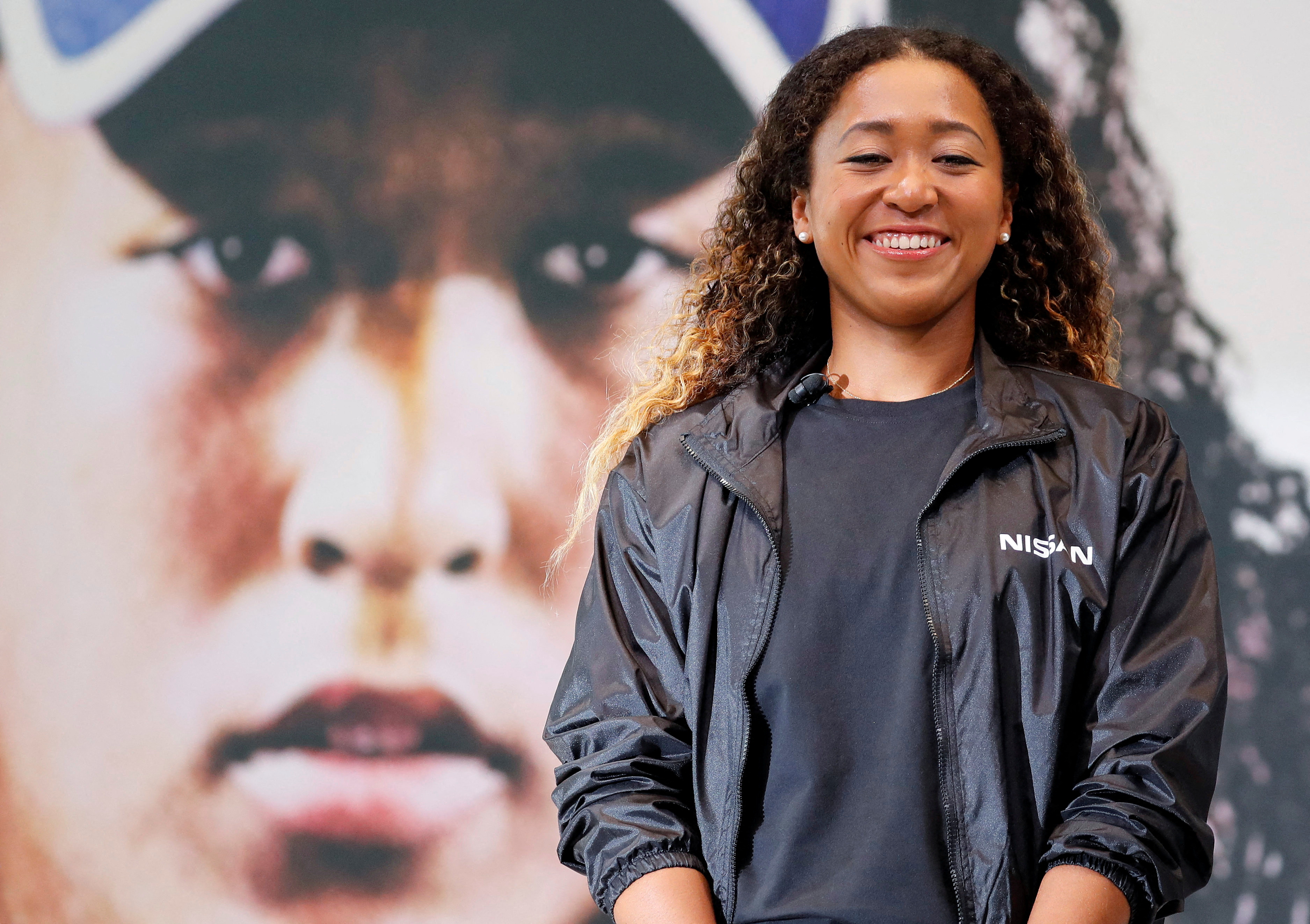 Naomi Osaka attends a contract signing ceremony at Nissan's global headquarters in Yokohama