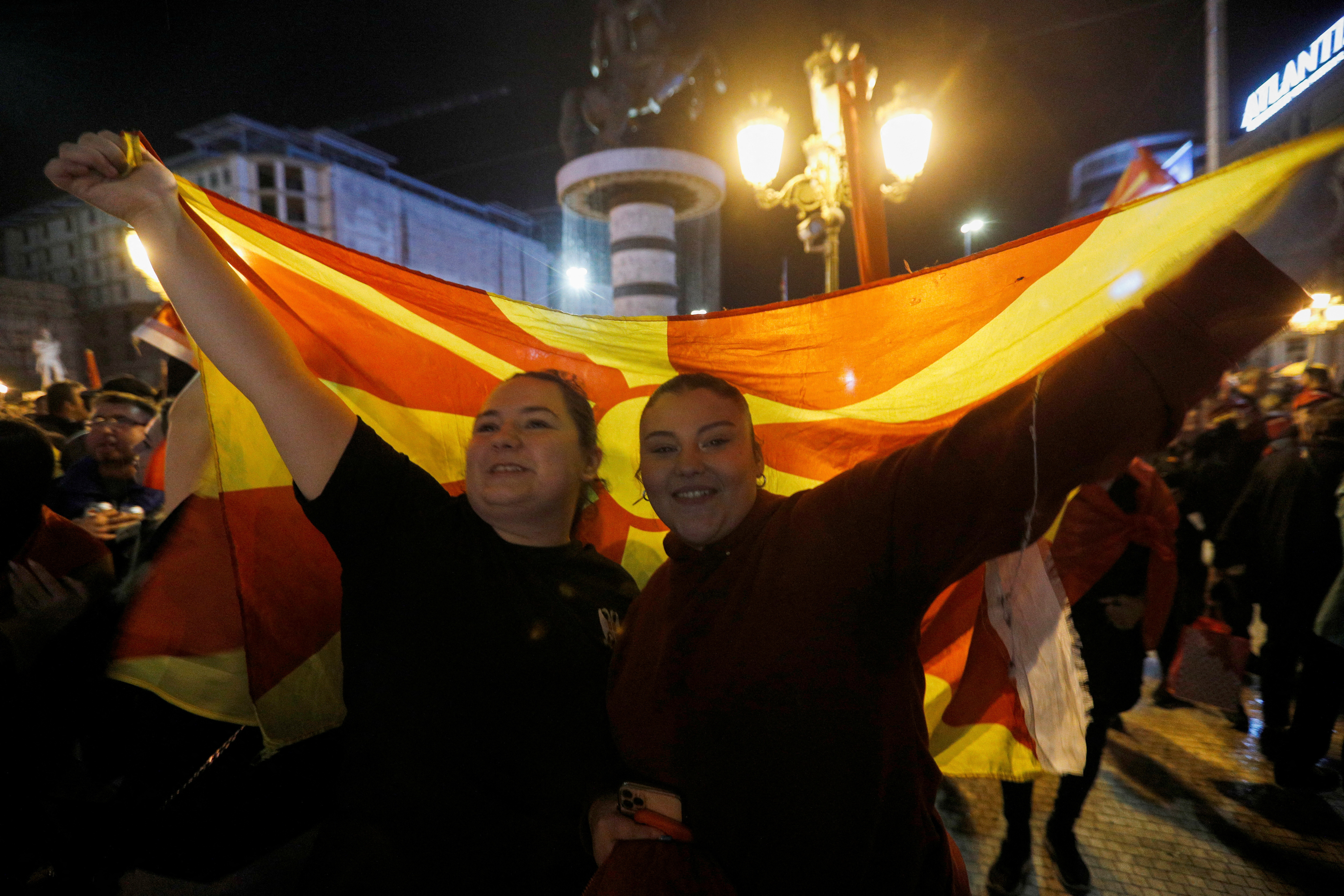 Supporters of VMRO-DPMNE party celebrate following the parliamentary and presidential elections in Skopje
