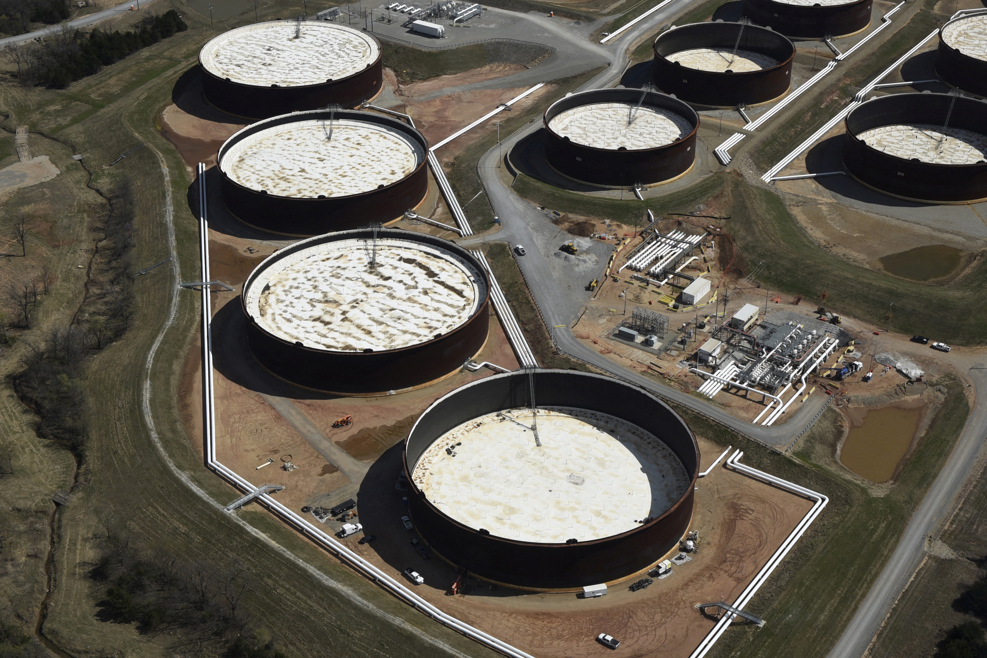 Crude oil storage tanks are seen from above at the Cushing oil hub, appearing to run out of space to contain a historic supply glut that has hammered prices, in Cushing, Oklahoma, March 24, 2016. Picture taken March 24, 2016. REUTERS/Nick Oxford