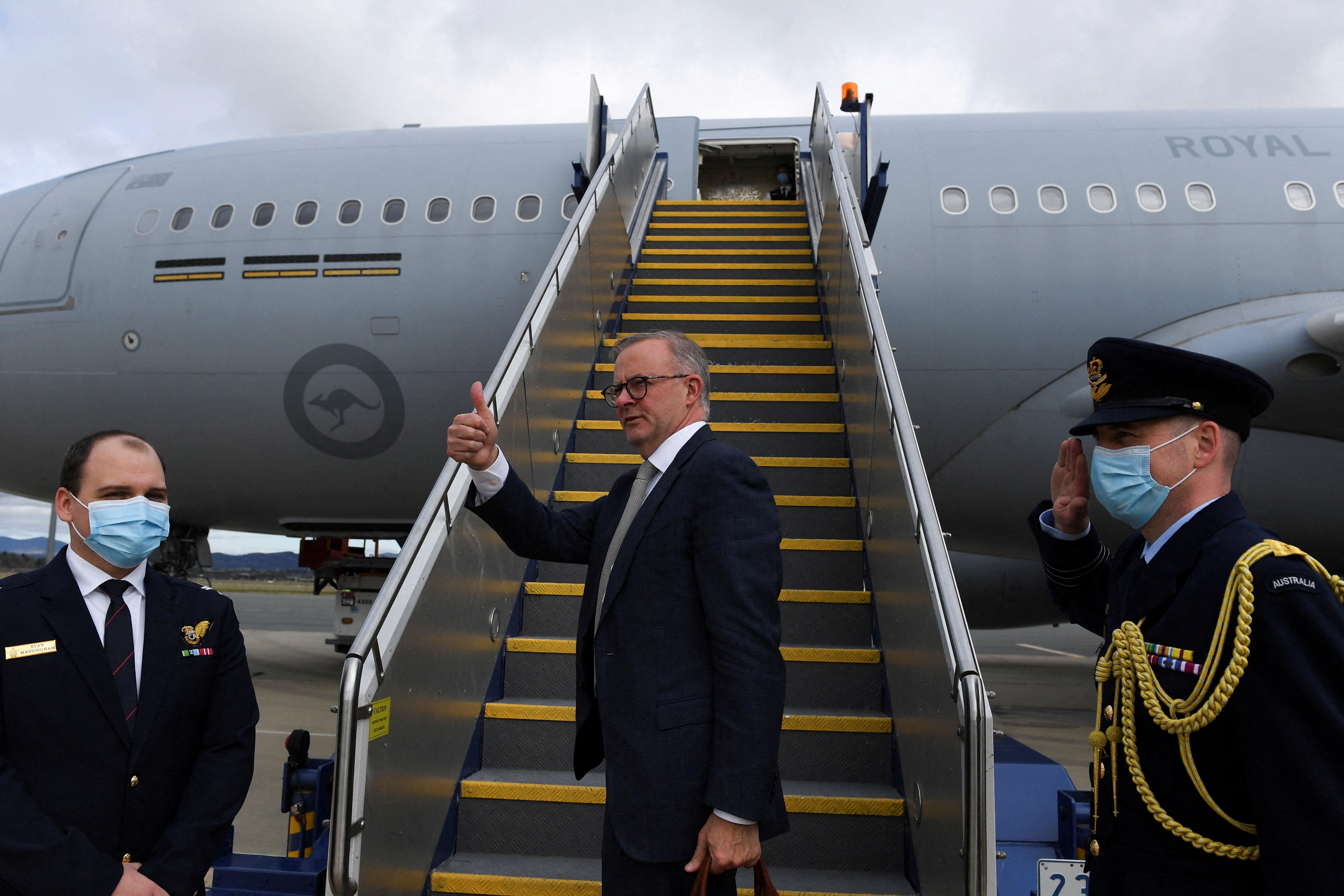 Australian Prime Minister Anthony Albanese boards the plane to Japan to attend the QUAD leaders meeting in Tokyo, in Canberra