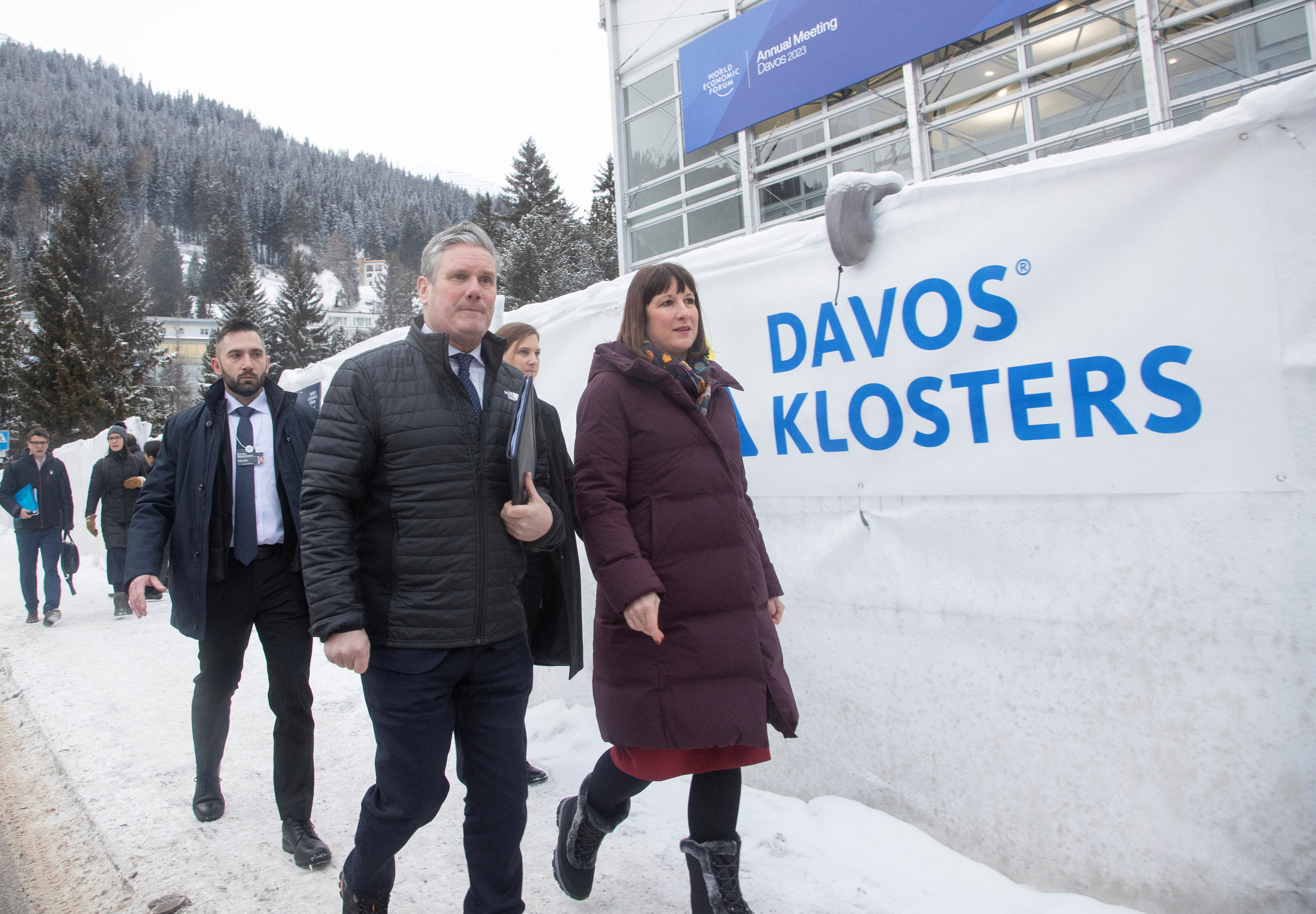 Britain's Labour leader Starmer and the party's financial chief Reeves walk to a meeting during the World Economic Forum in Davos