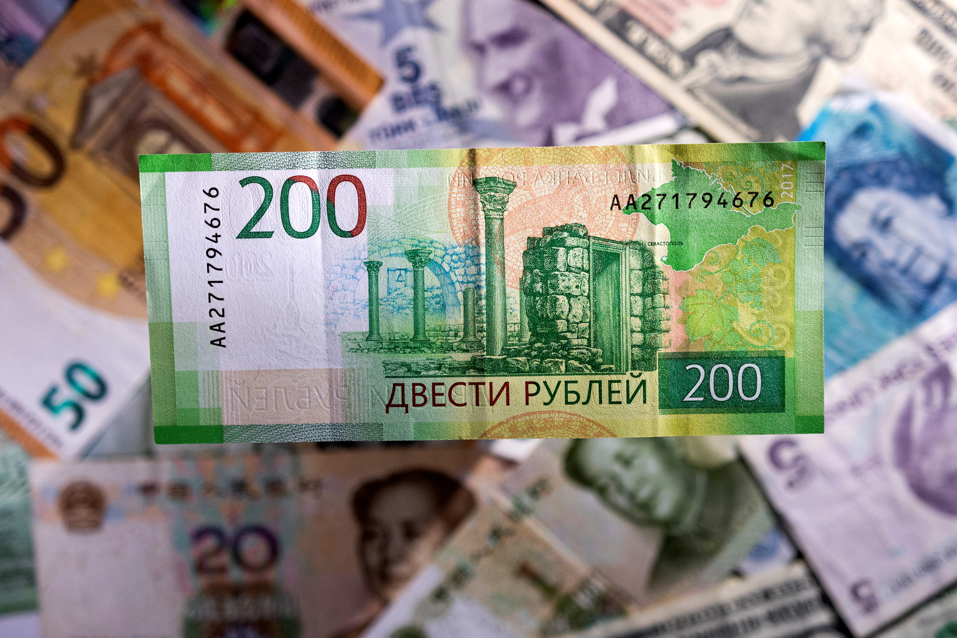 Illustration shows a Russian rouble banknote
