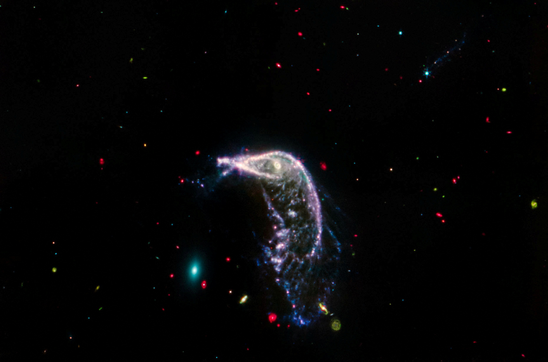 Arp 142, two interacting galaxies, are shown in an image obtained by the James Webb Space Telescope