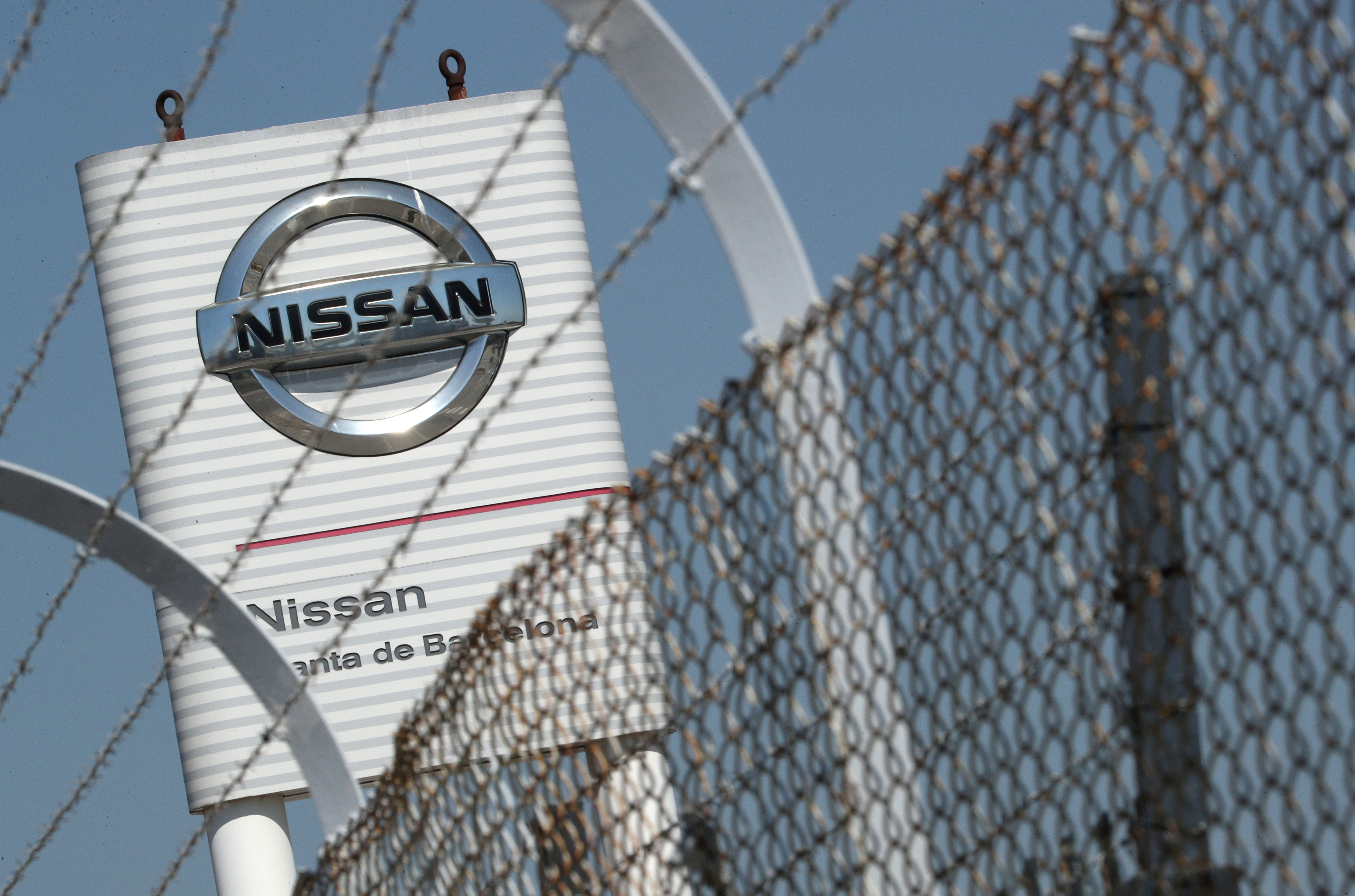 The logo of Nissan is seen through a fence at Nissan factory at Zona Franca during the coronavirus disease (COVID-19) outbreak in Barcelona