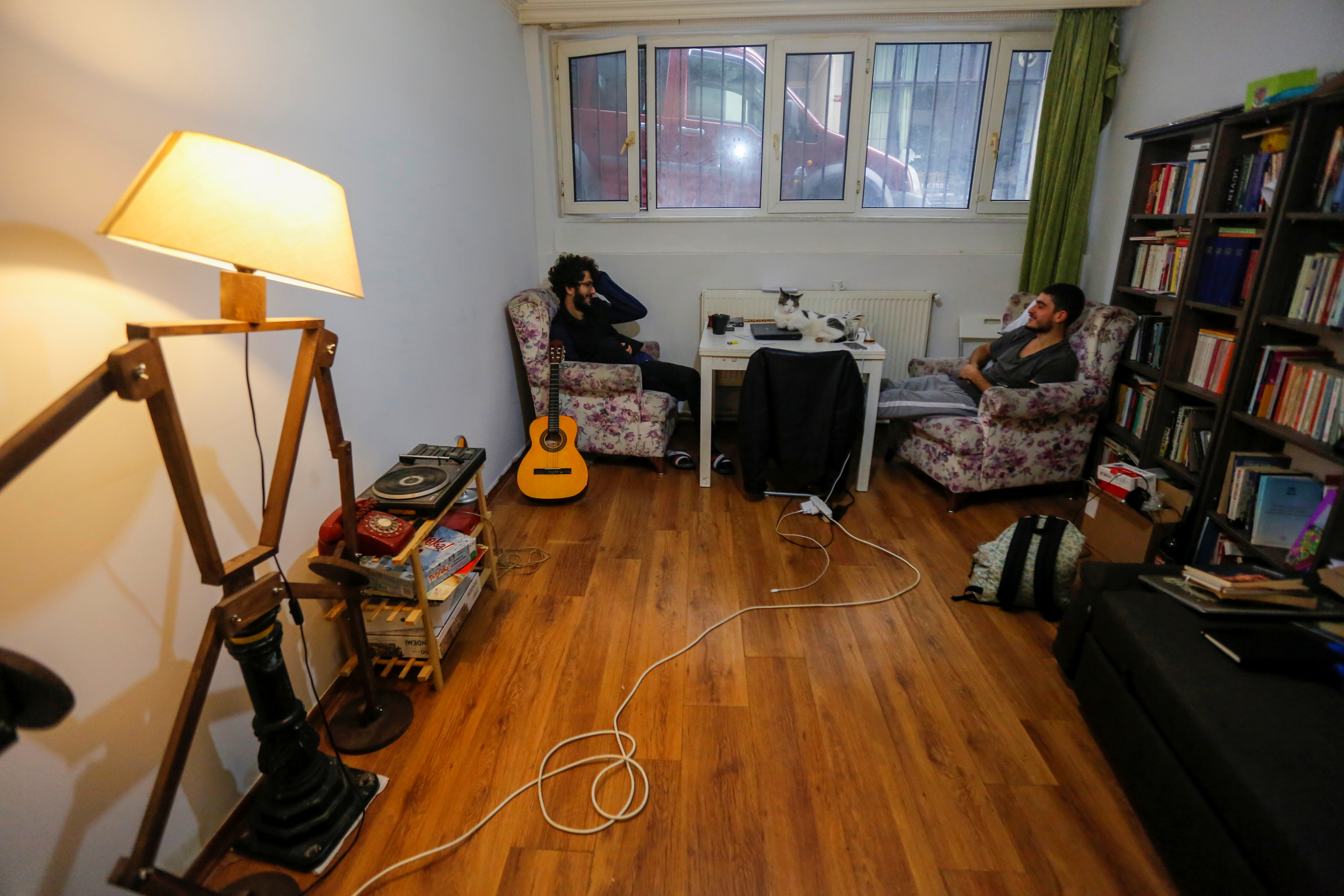University students Candeniz Aksu and Yunus Karaca chat in their rented home in Istanbul