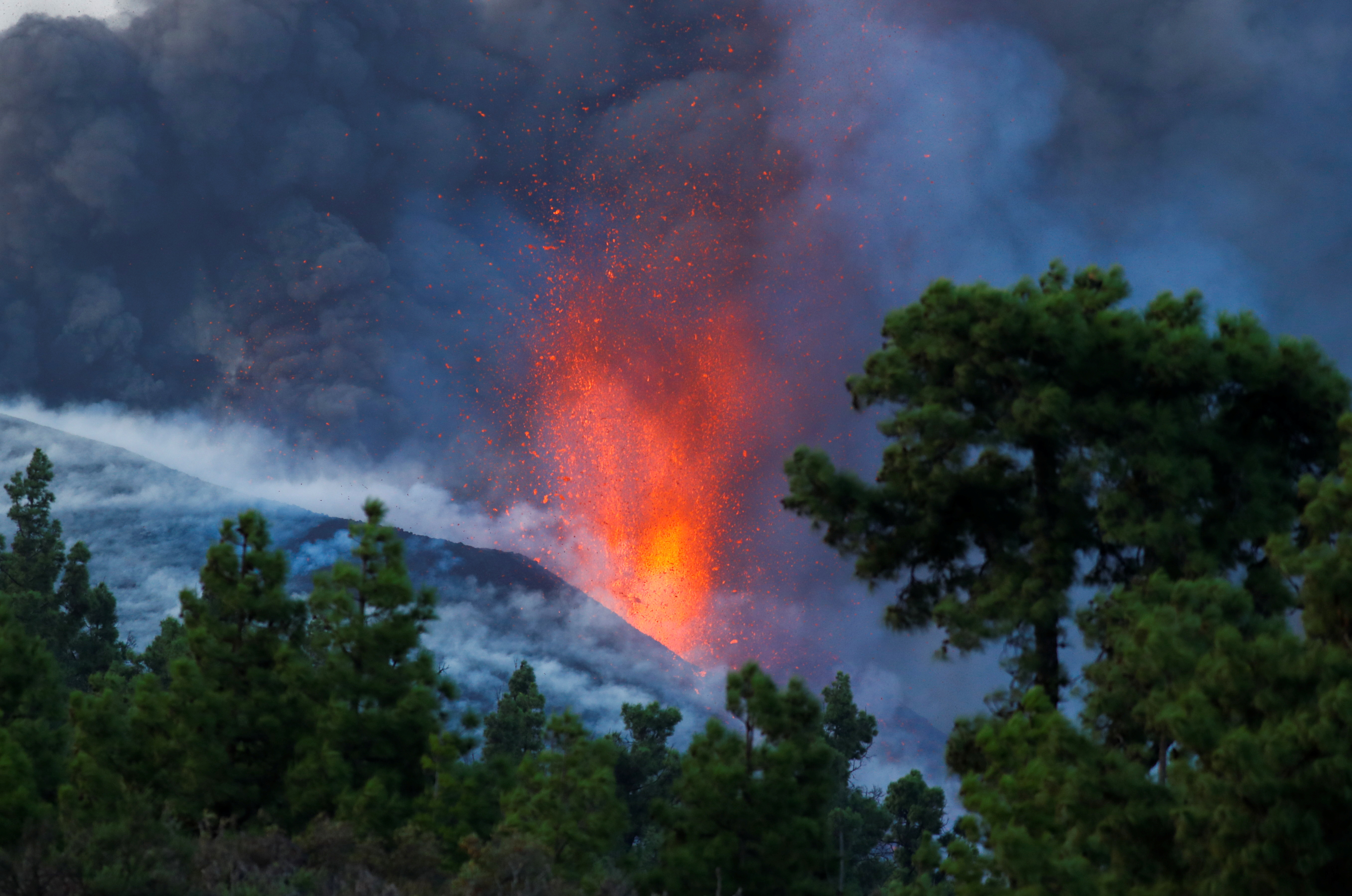 The Cumbre Vieja volcano continues to erupt on the Canary Island of La Palma, as seen from Tacande, Spain, October 2, 2021. REUTERS/Borja Suarez