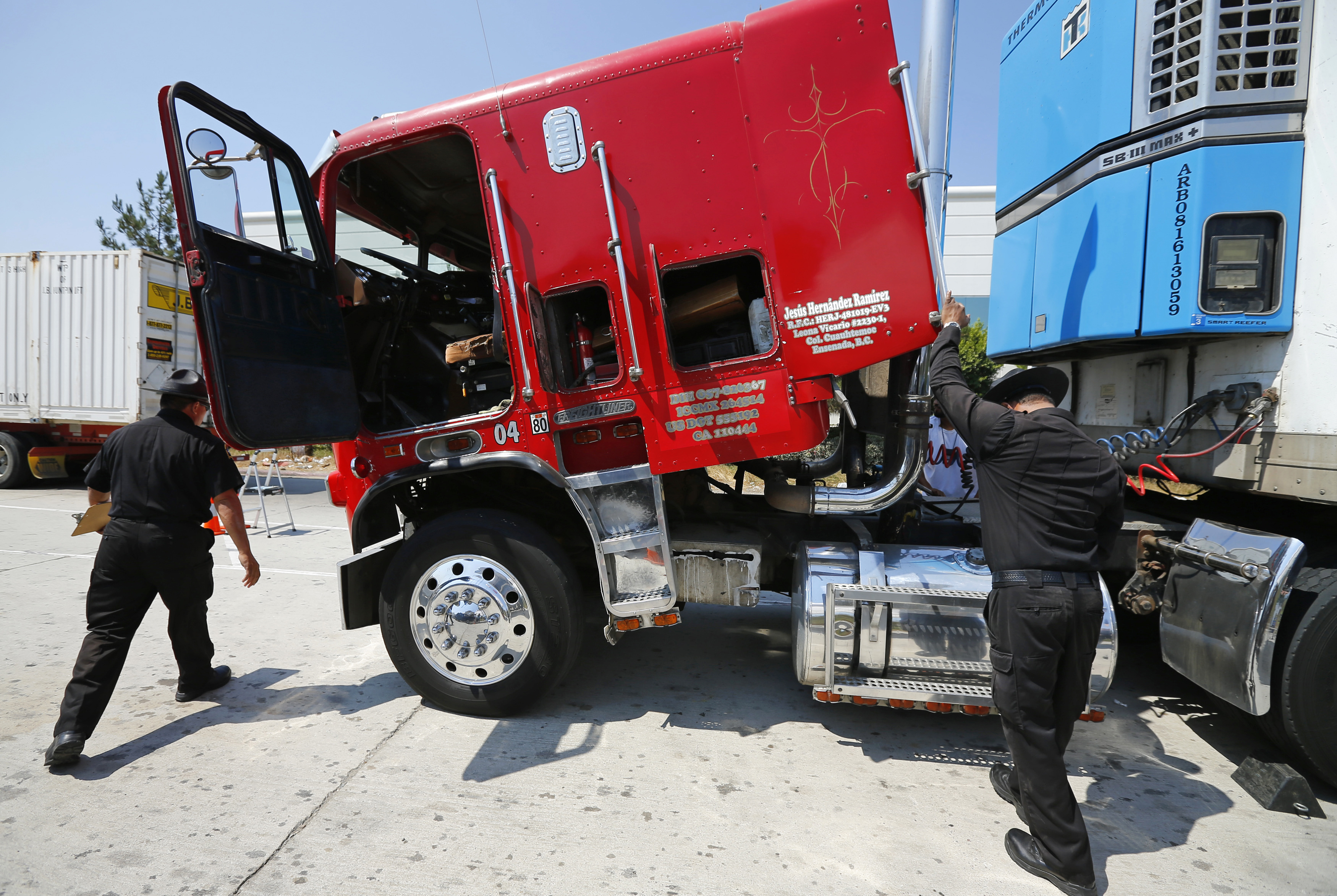 California Air Resources field representatives Armenta and Andujar work a checkpoint set up to inspect heavy-duty trucks traveling near the Mexican-U.S. border in Otay Mesa, California