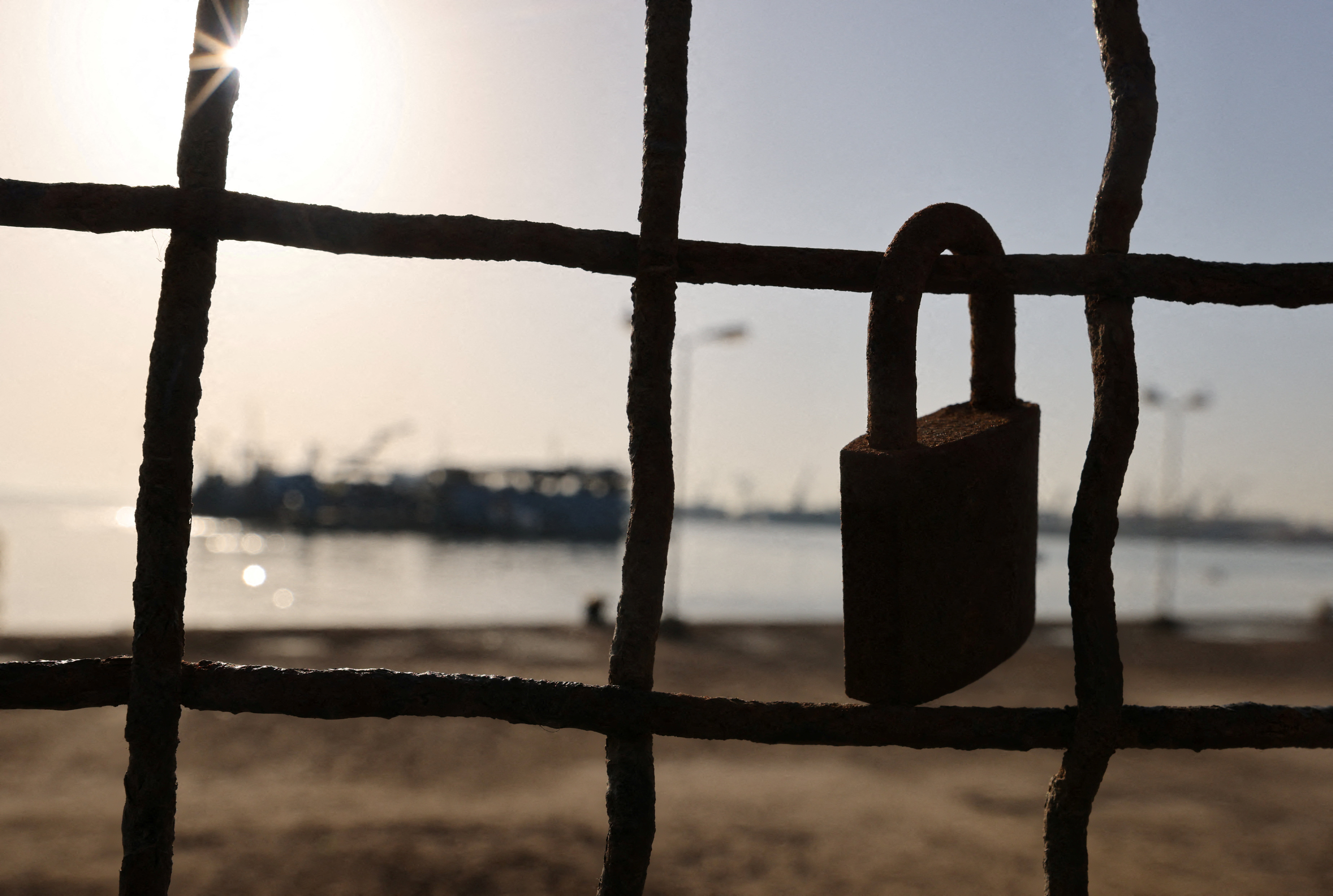 A "love lock" hangs on a metal fence near the canal of Port Said