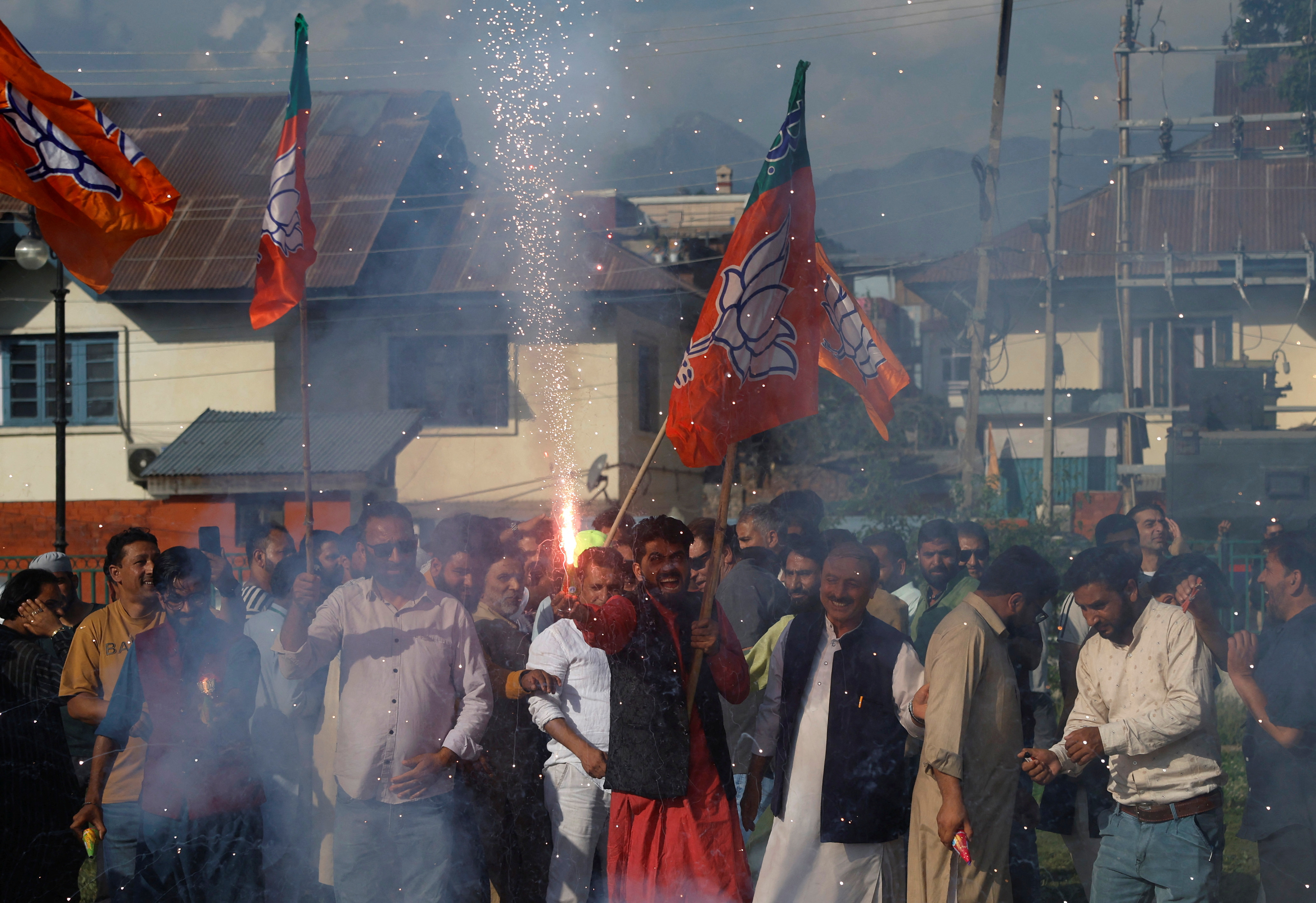Supporters of Bharatiya Janata Party light fireworks to celebrate on the day of the general election results, in Srinagar