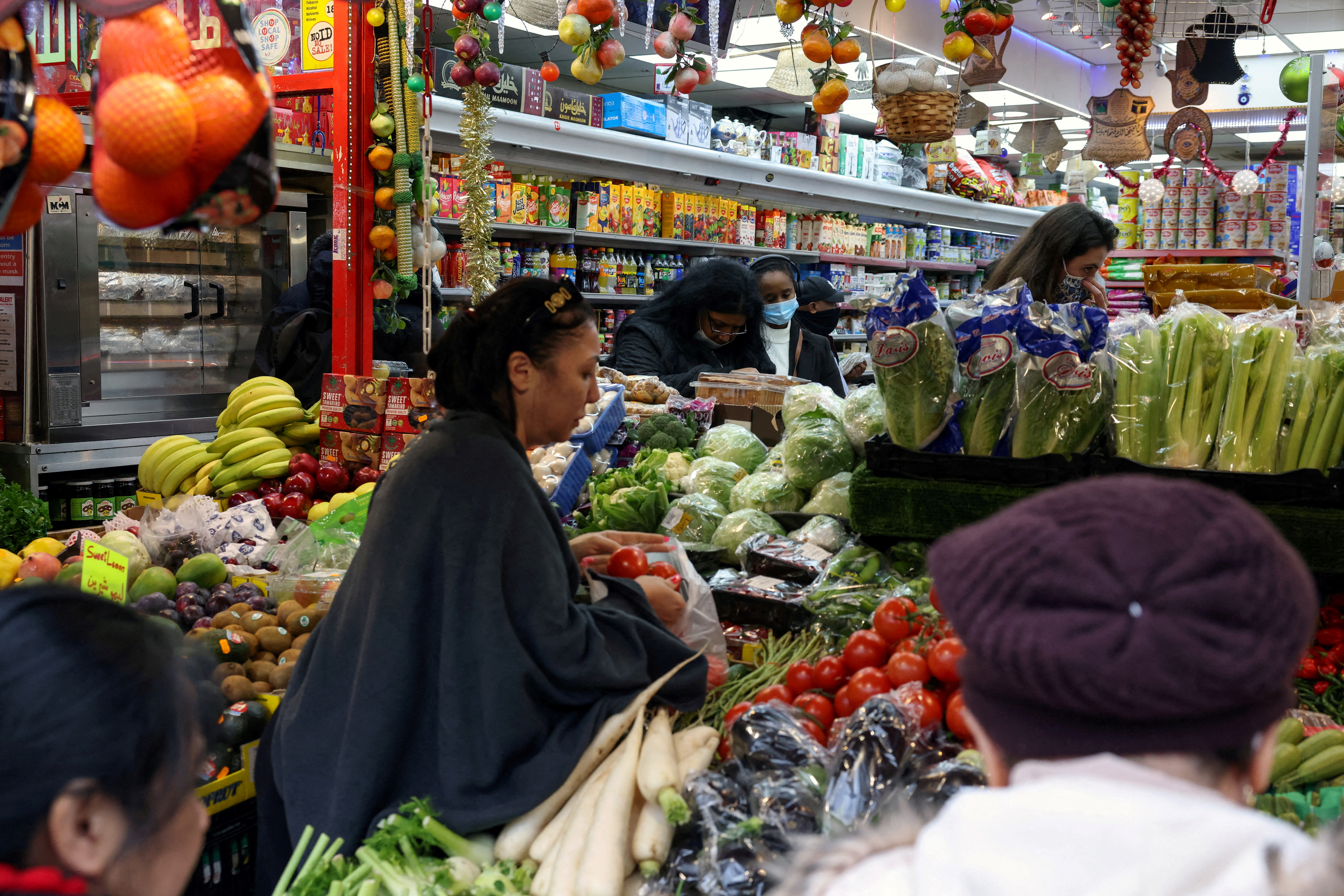 People shop at a supermarket amid the coronavirus disease (COVID-19) outbreak, in London