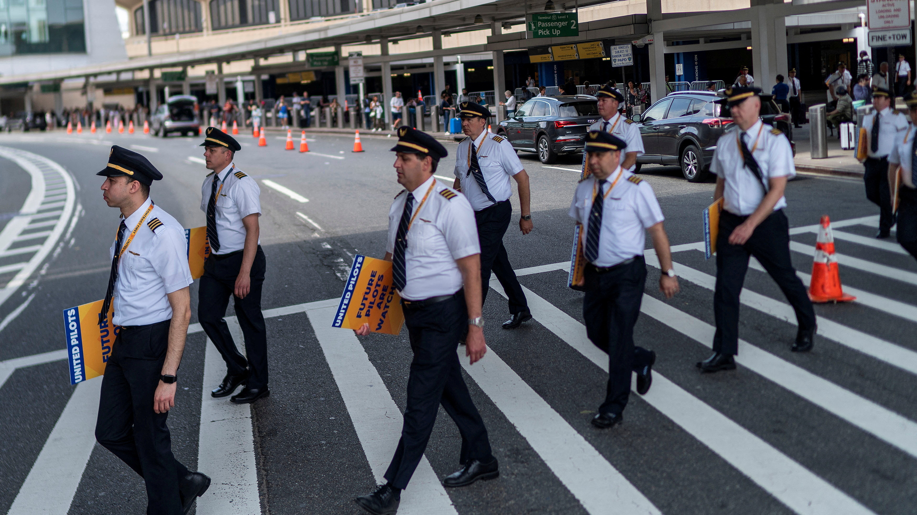 Pilots from United Airlines take part in an informational picket at Newark Liberty International Airport in Newark