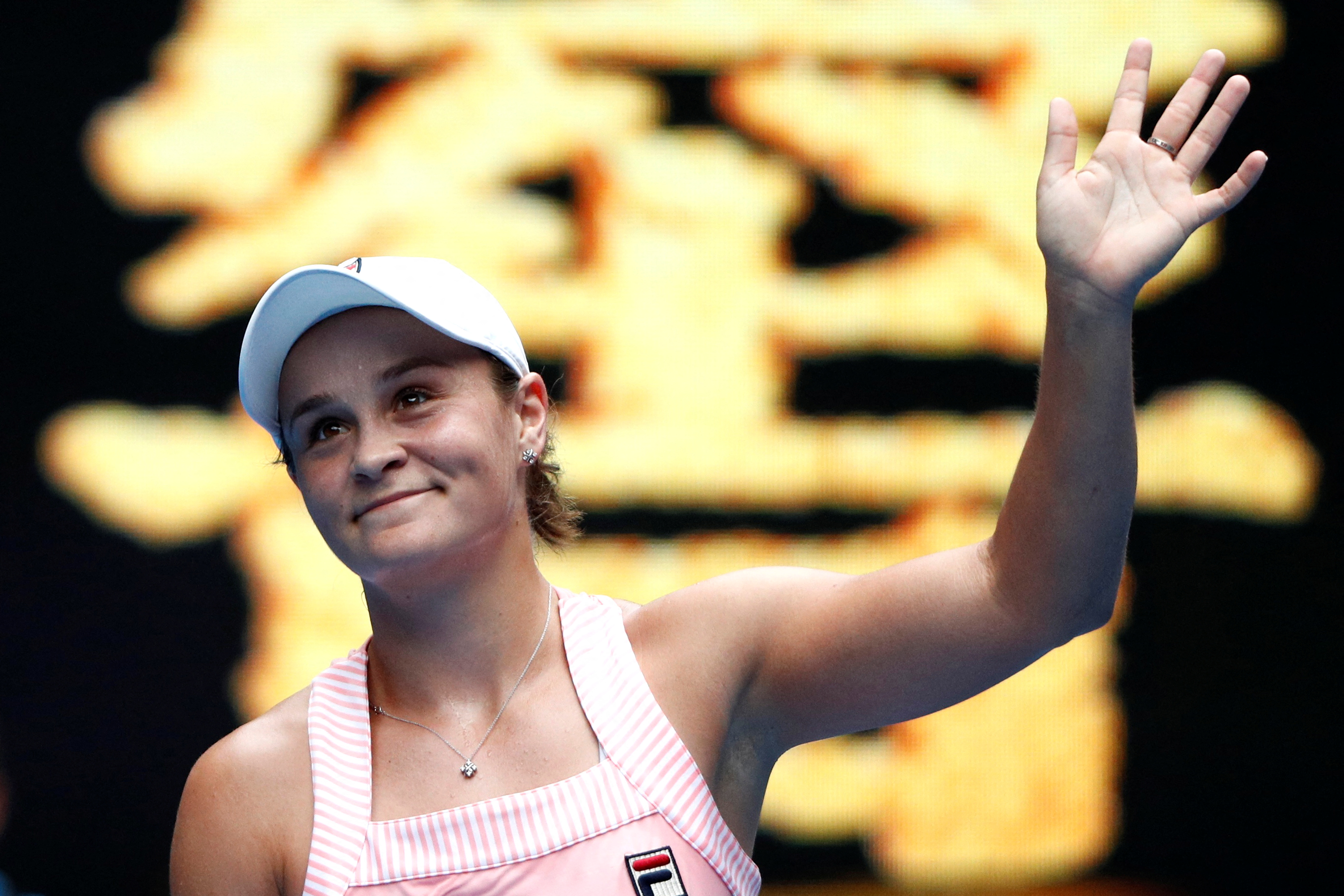 Australia's Ashleigh Barty waves to spectators after winning the match against China's Wang Yafan