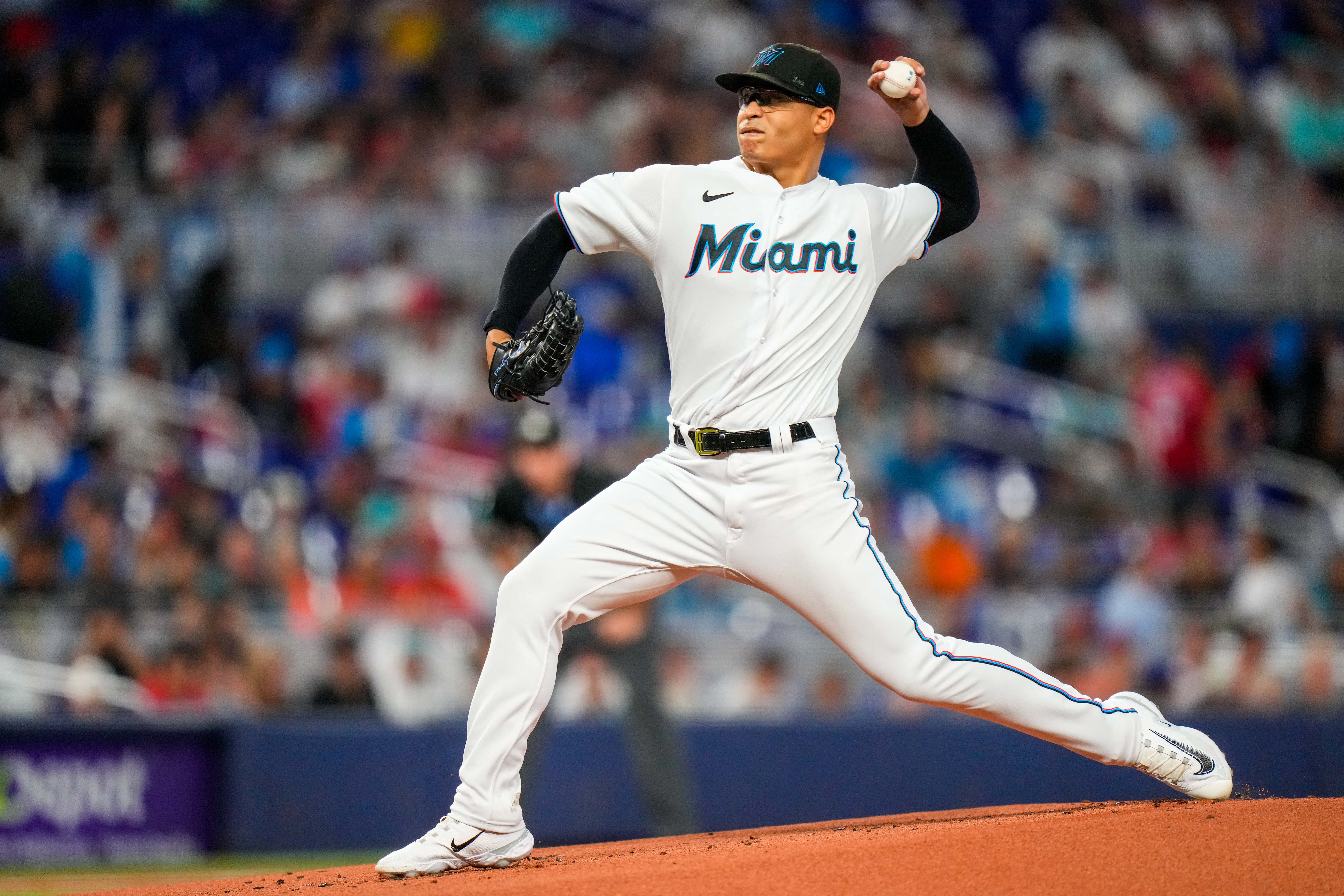 Miami Marlins' Jean Segura runs to beat the throw by Philadelphia Phillies  second baseman Bryson Stott but is out at the plate during the eighth  inning of a baseball game, Sunday, July