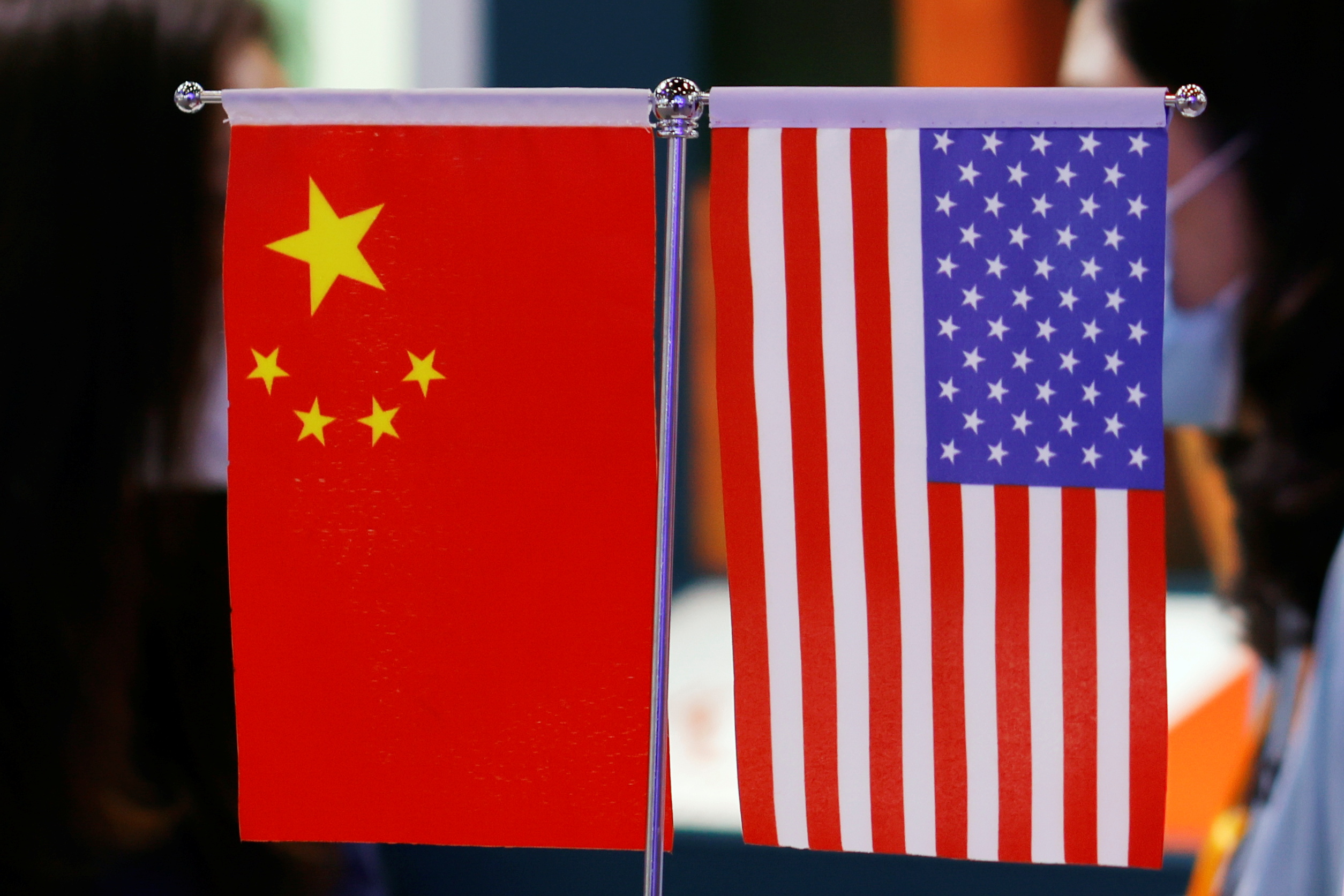 Chinese and U.S. flags displayed at the 2021 China International Fair for Trade in Services (CIFTIS) in Beijing, China September 4, 2021. REUTERS/Florence Lo