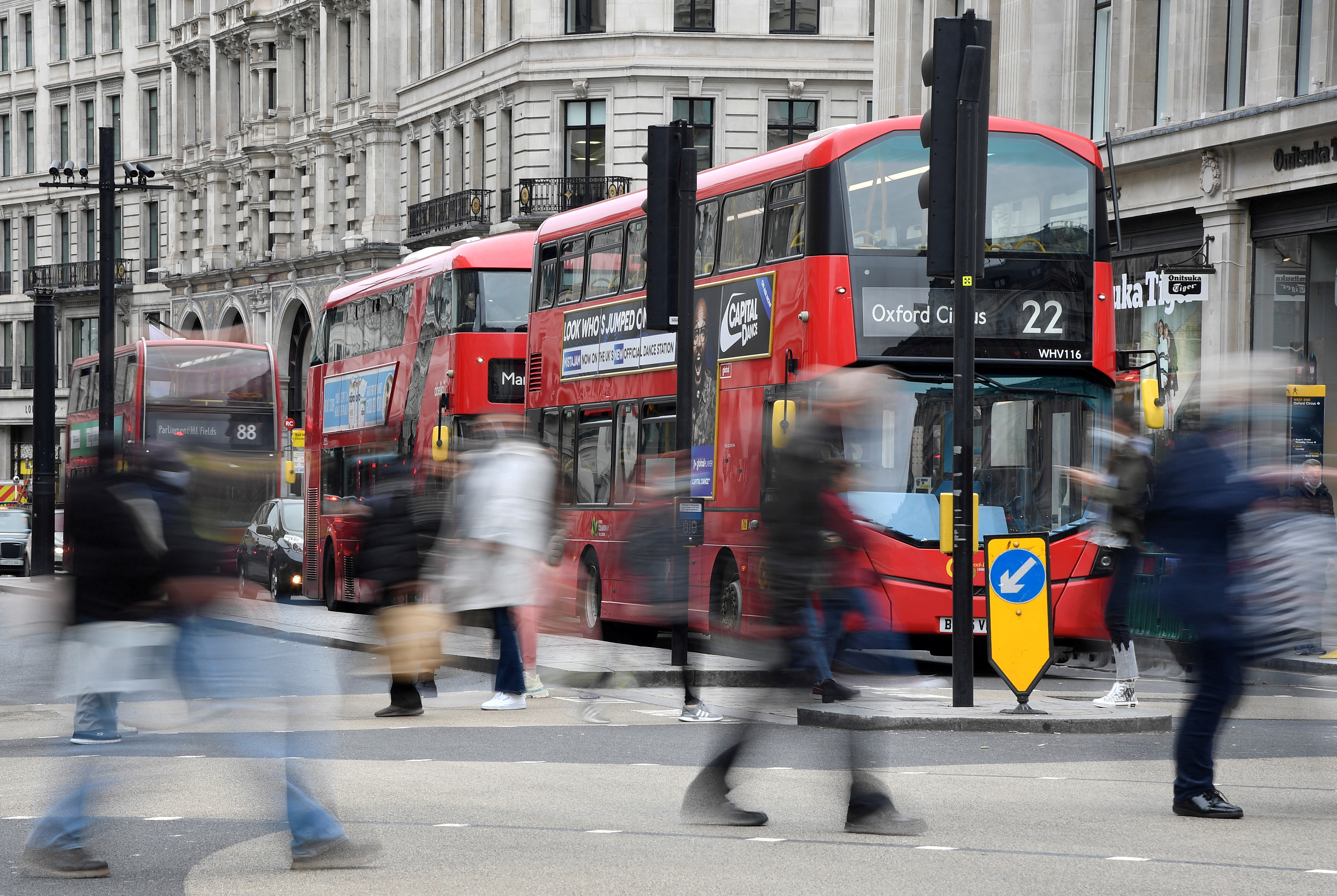 Return to high streets drives rise in UK shopper numbers | Reuters