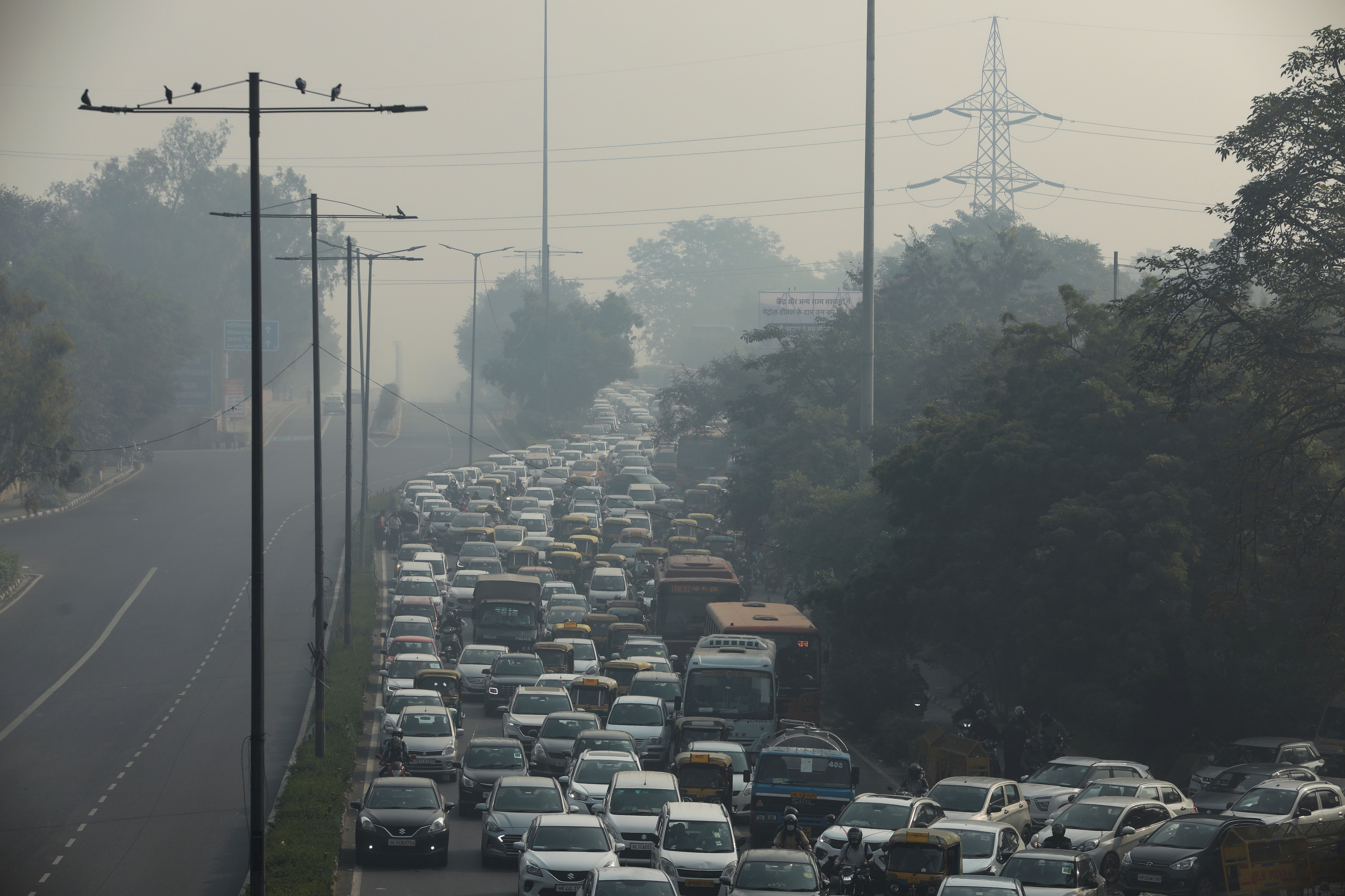Vehicles are seen shrouded in smog in New Delhi, India
