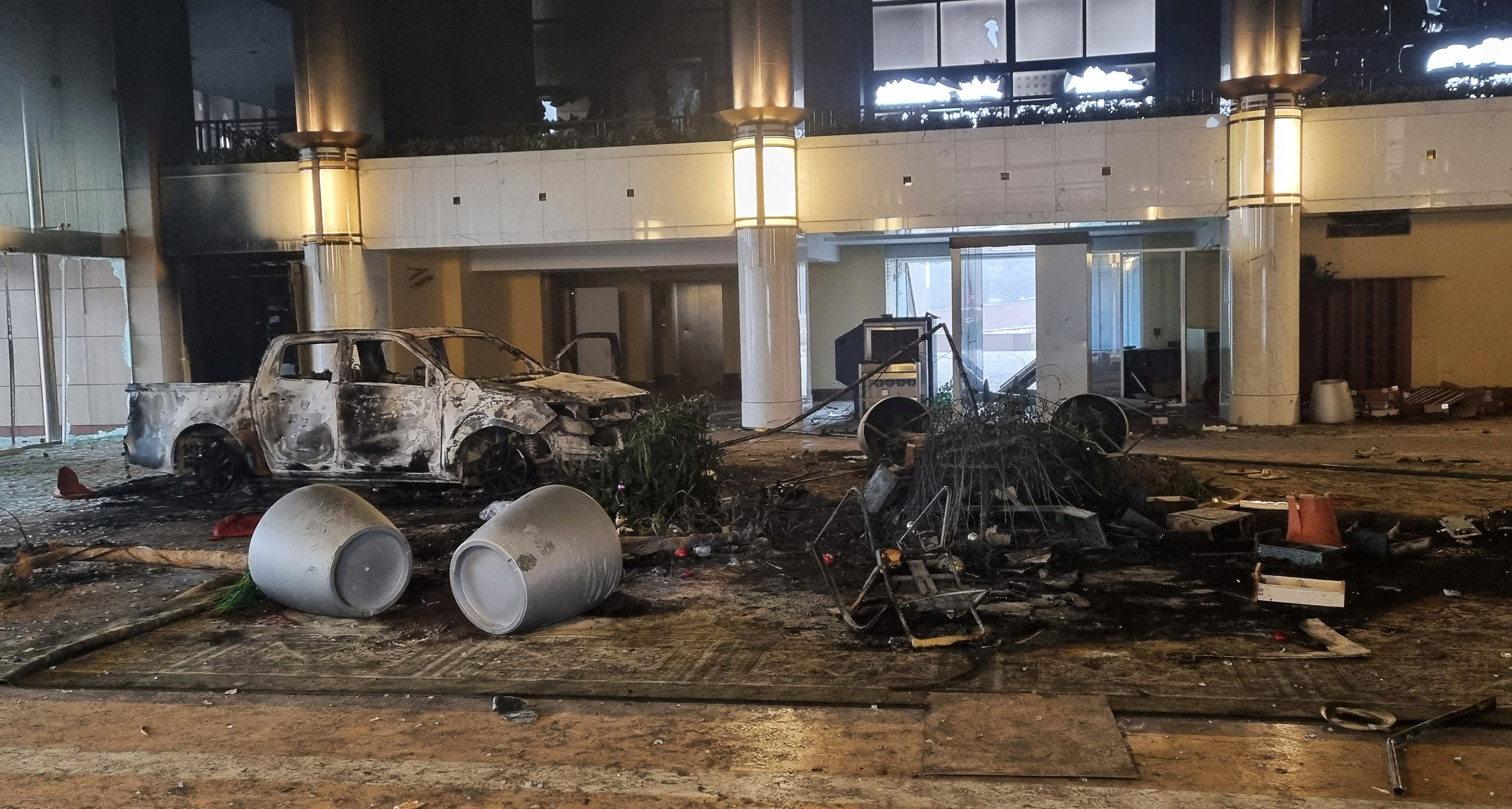 A burned car is seen inside the Presidential Residence in Almaty