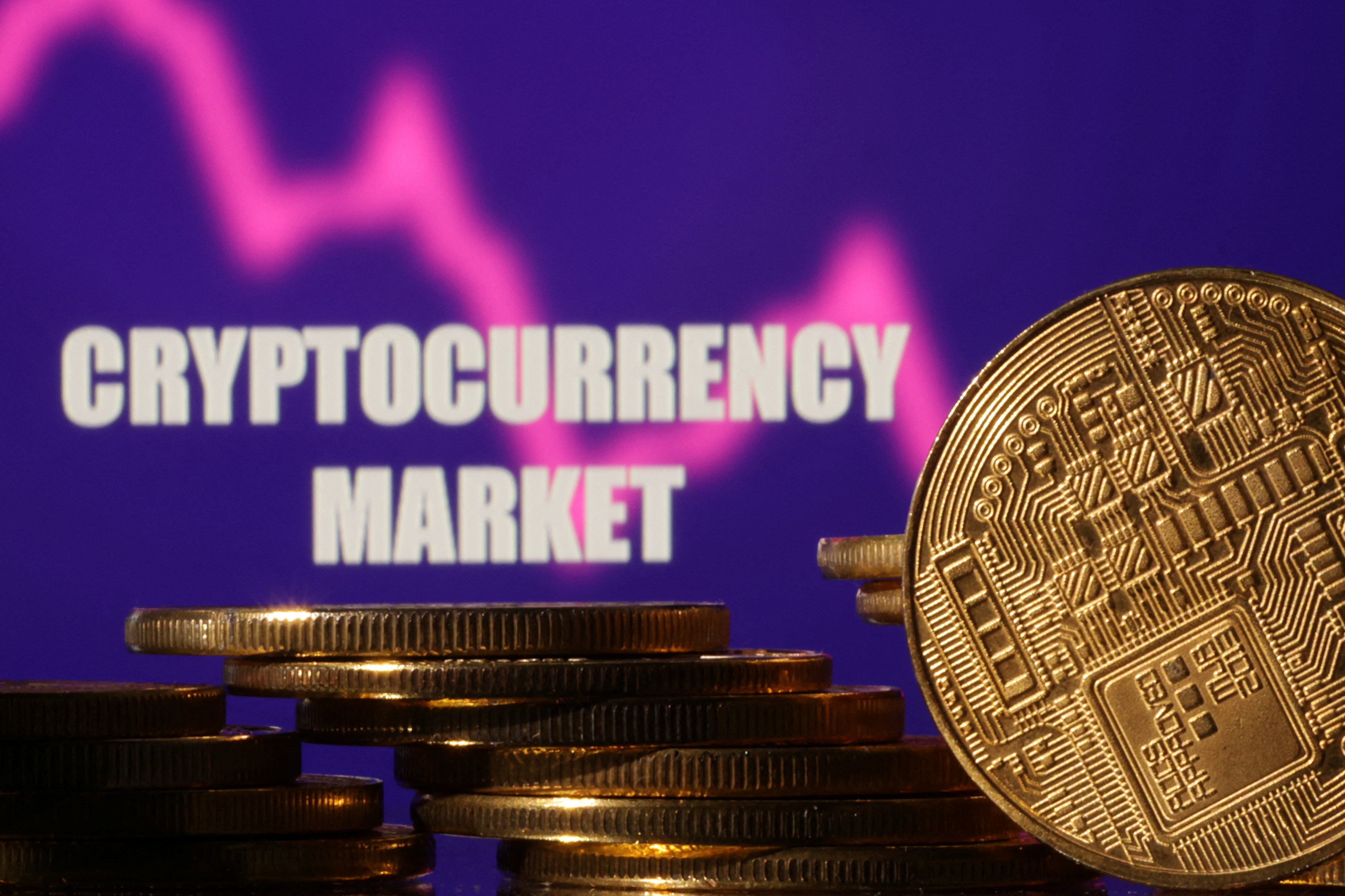 Illustration shows words "Cryptocurrency market", stock graph and representation of cryptocurrencies