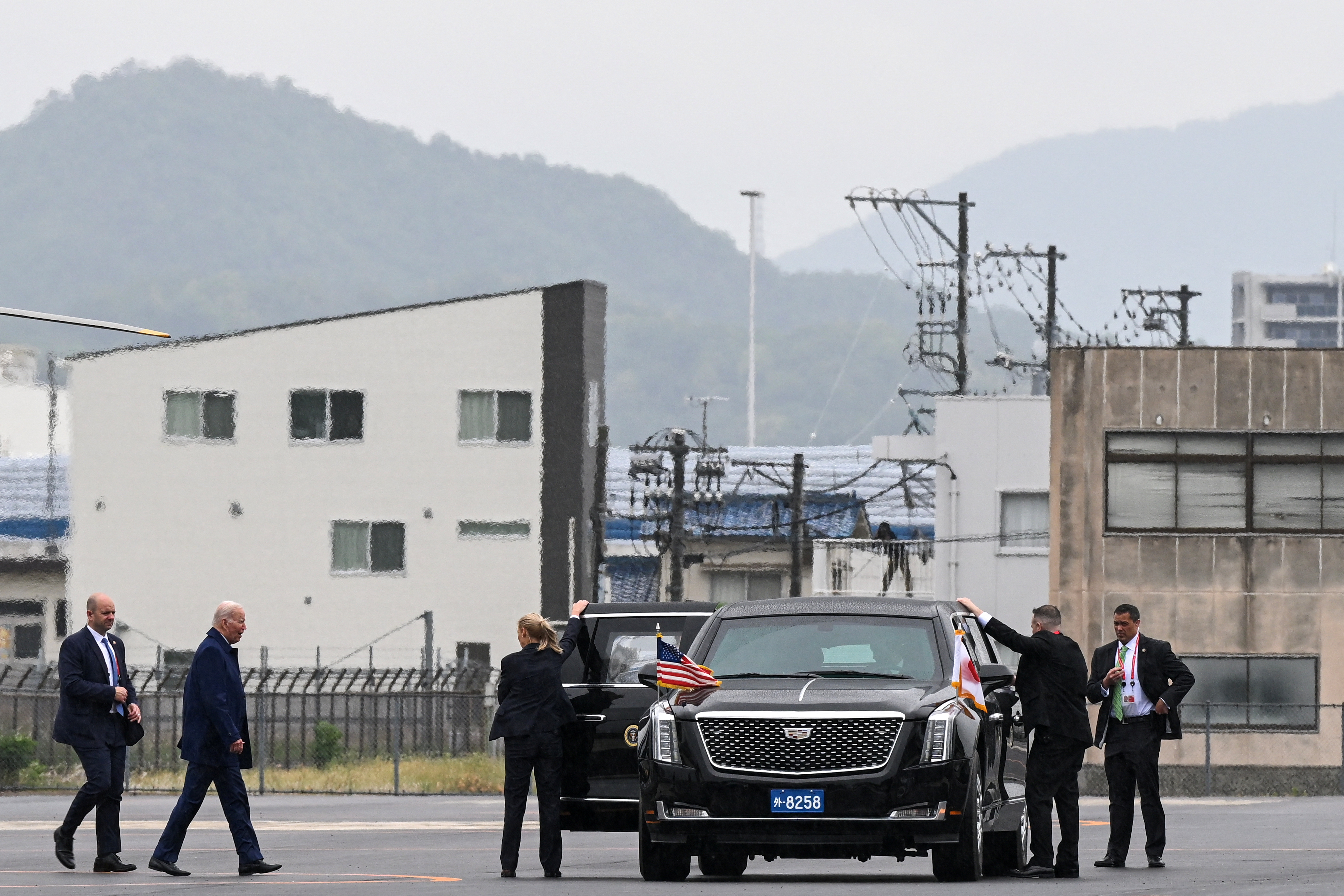 U.S. President Joe Biden walks to his vehicle in Hiroshima