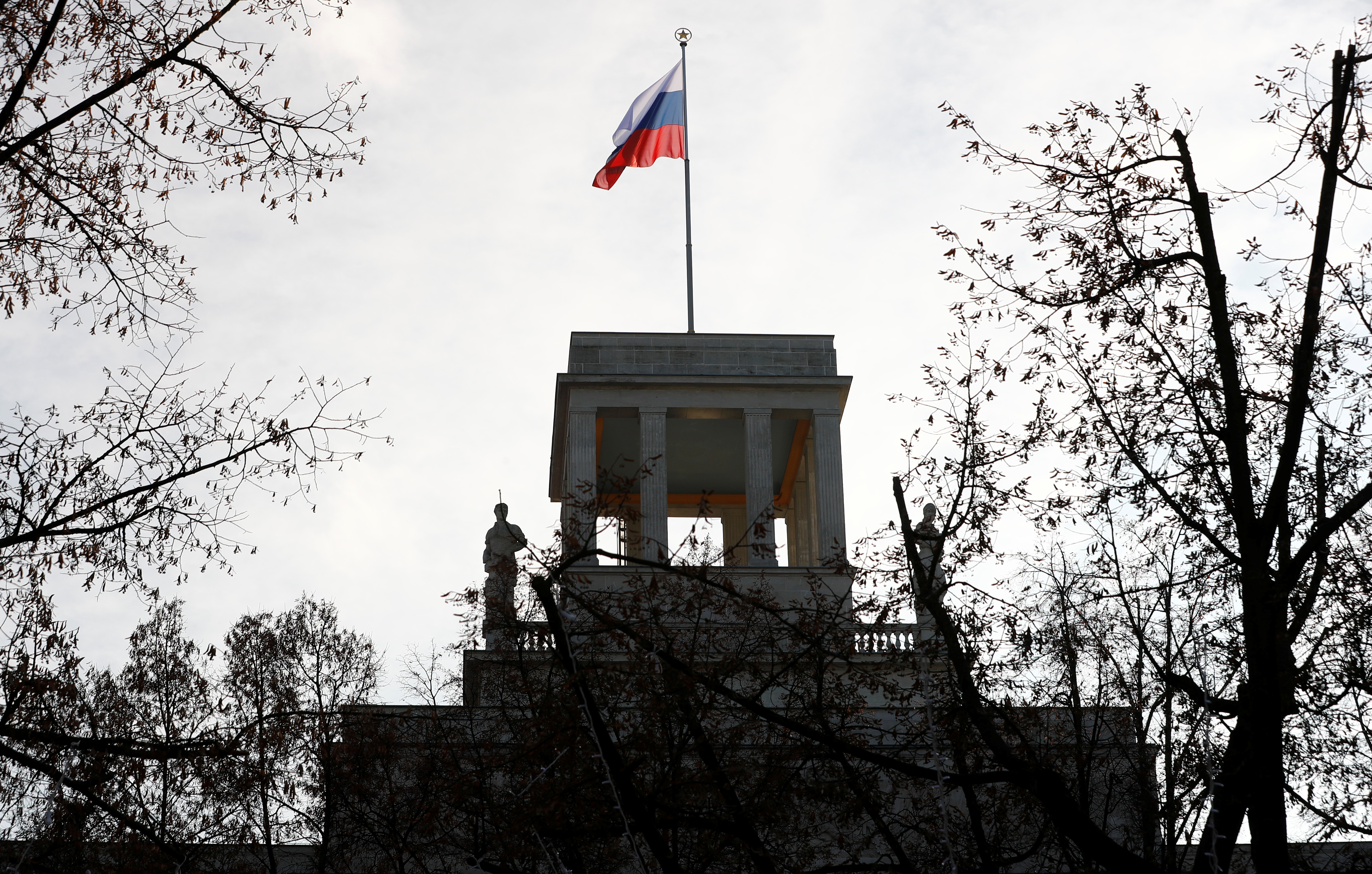 The national flag flutters on top of the Russian embassy after Germany expelled two Russian diplomats in Berlin