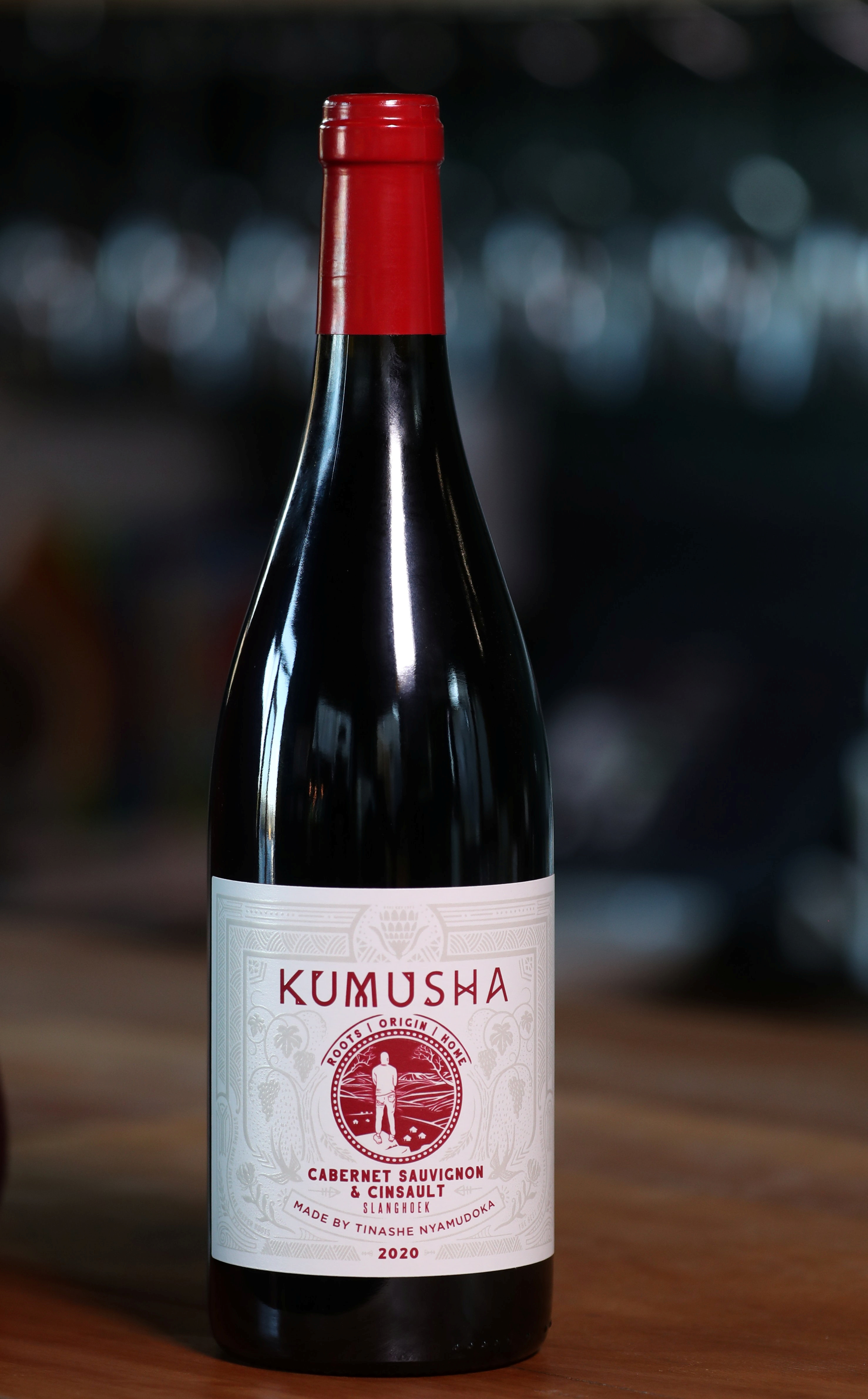 A bottle of Kumusha wine, a brand owned by Zimbabwean sommelier Tinashe Nyamudoka, is pictured in Johannesburg, South Africa, June 25, 2021. REUTERS/Siphiwe Sibeko
