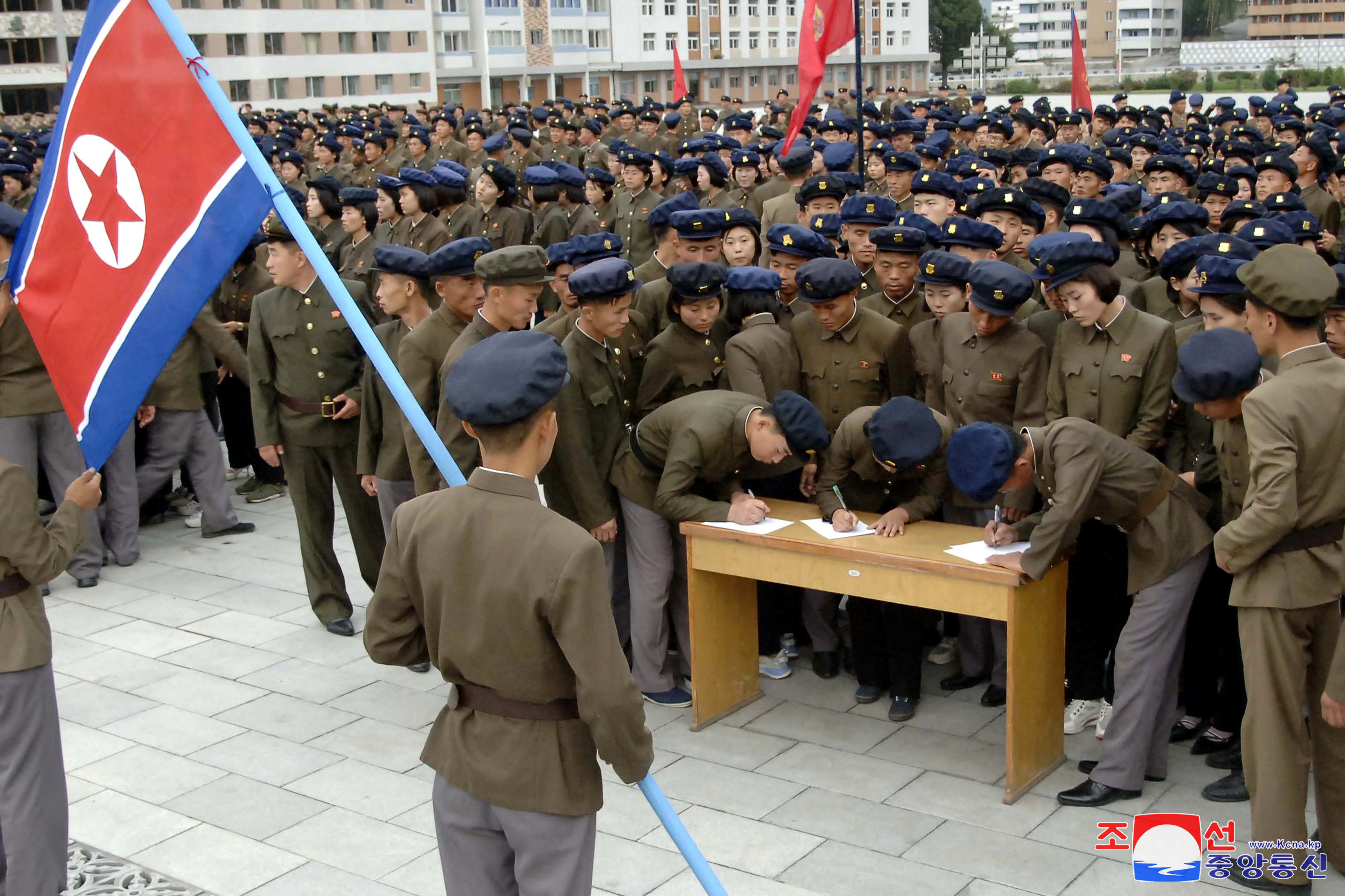 Young people, including students and youth league officials, sign petitions to join or return to the army this week, according to North Korean state media, at an undisclosed location in North Korea