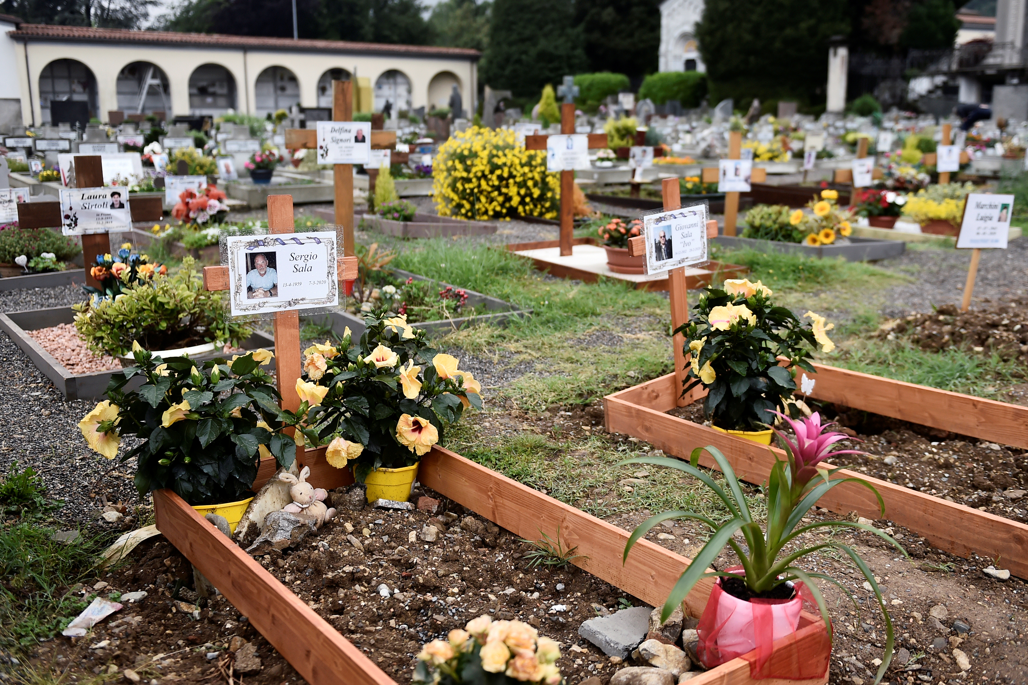 Graves of people who had recently died due to COVID-19 are seen at the cemetery of Nembro, near Bergamo