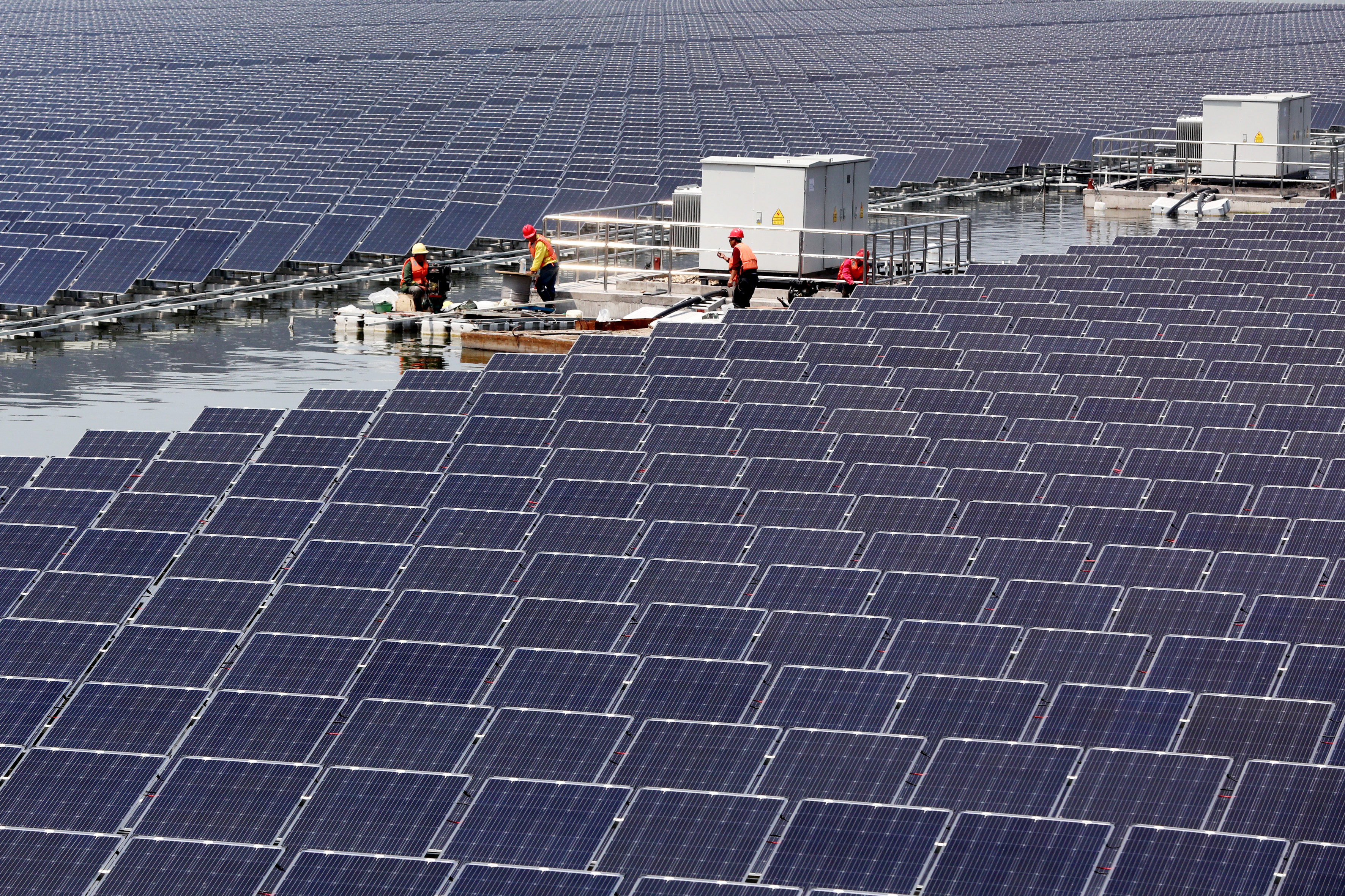Solar panels are seen at a floating solar plant in Huaibei