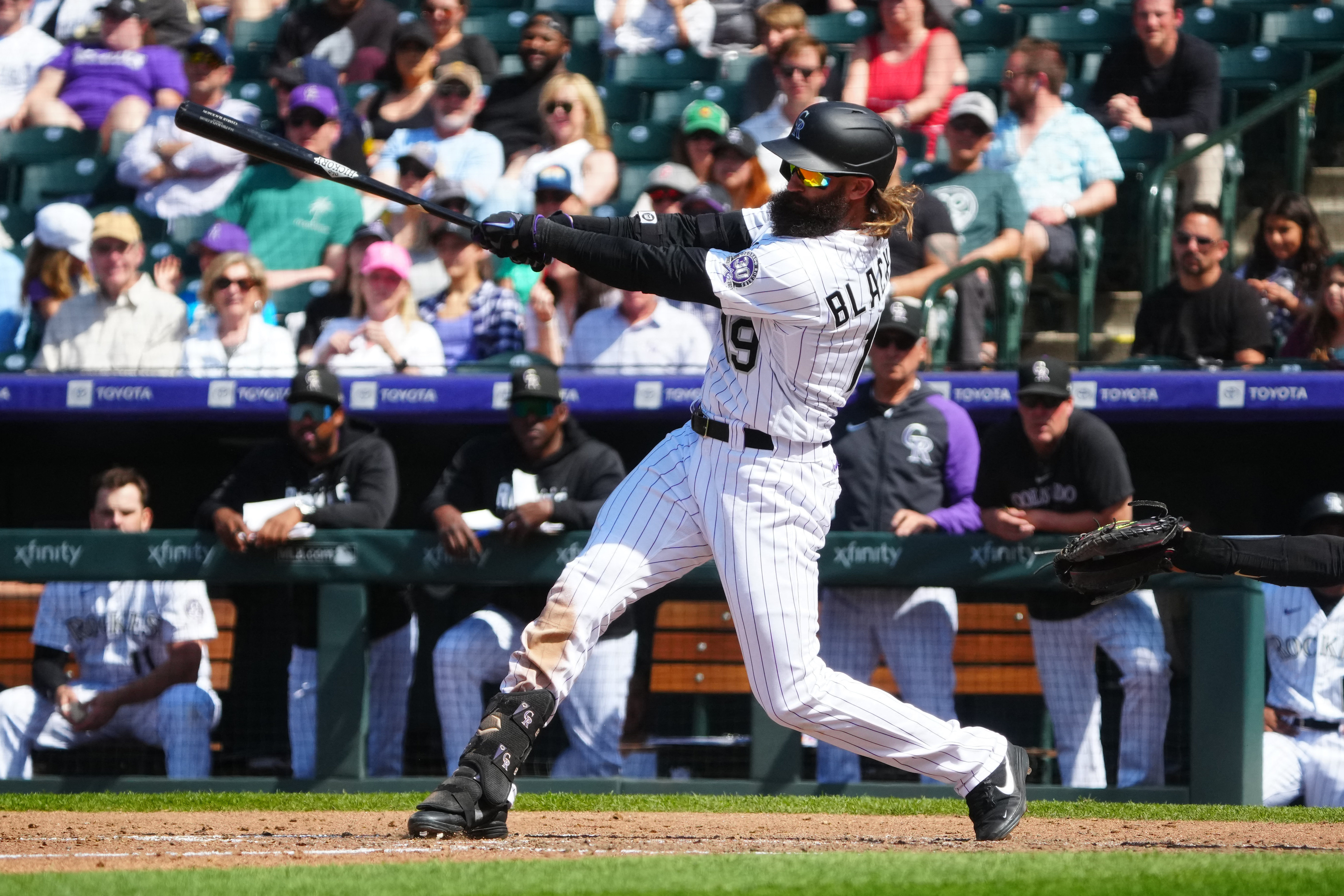 Rockies offense explodes in 12-4 win to avoid sweep