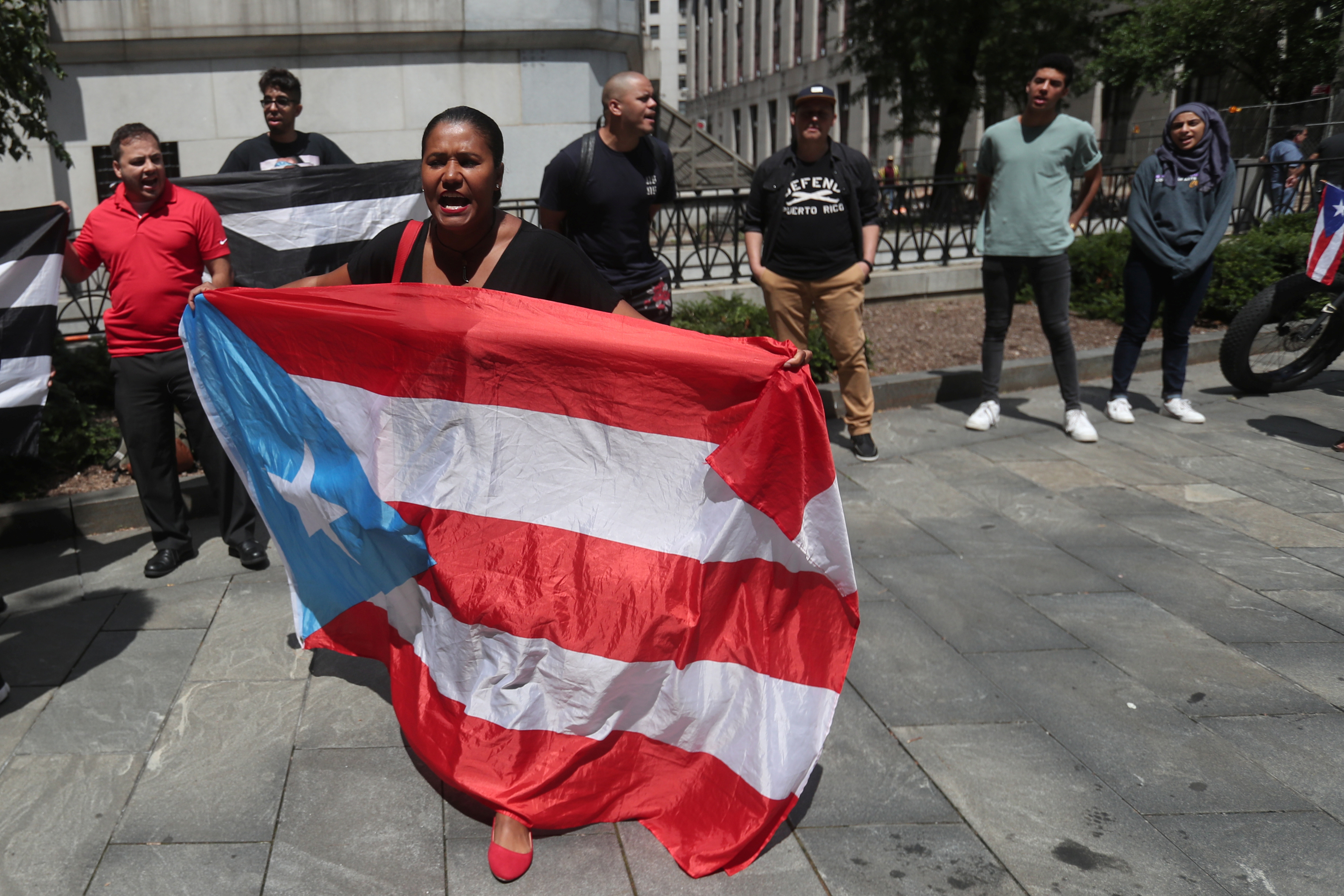 Demonstrators rally to cancel Puerto Rico's debt outside United States Court in the Manhattan borough of New York City