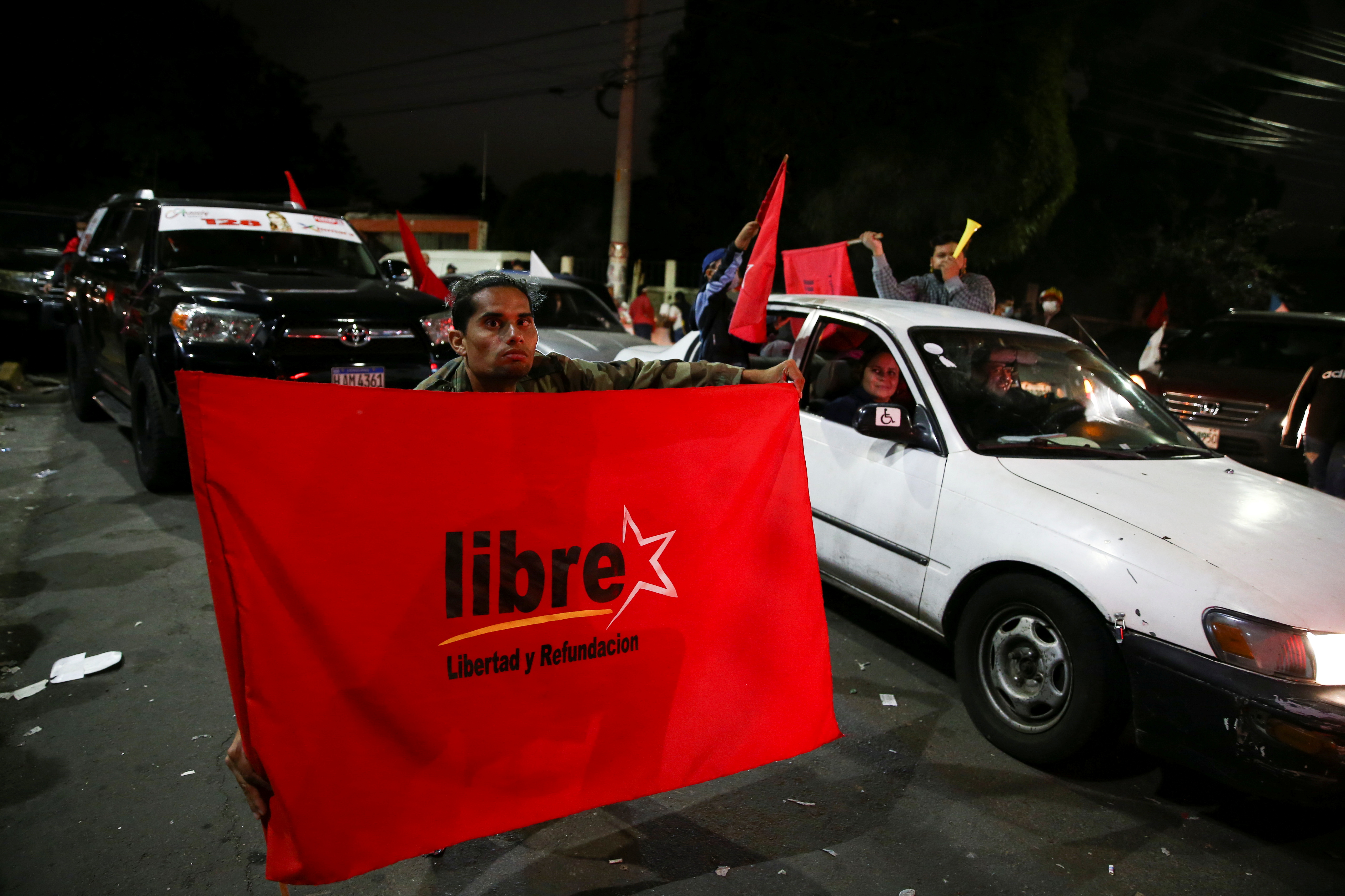 Supporters of Xiomara Castro, presidential candidate of the Liberty and Refoundation Party (LIBRE), celebrate at their headquarters in Tegucigalpa, Honduras, November 29, 2021. REUTERS/Jose Cabezas