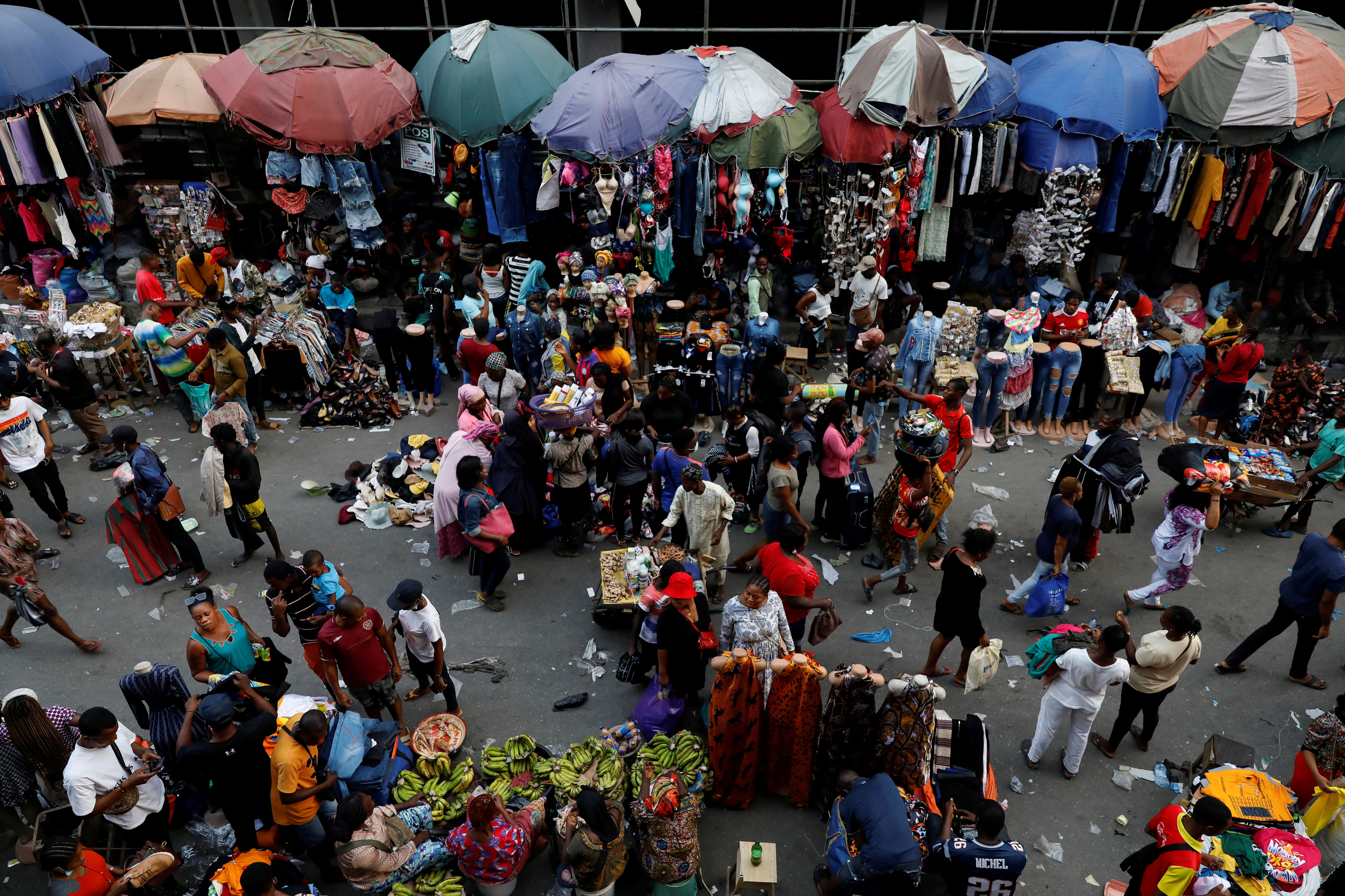 People crowd a market place in Lagos