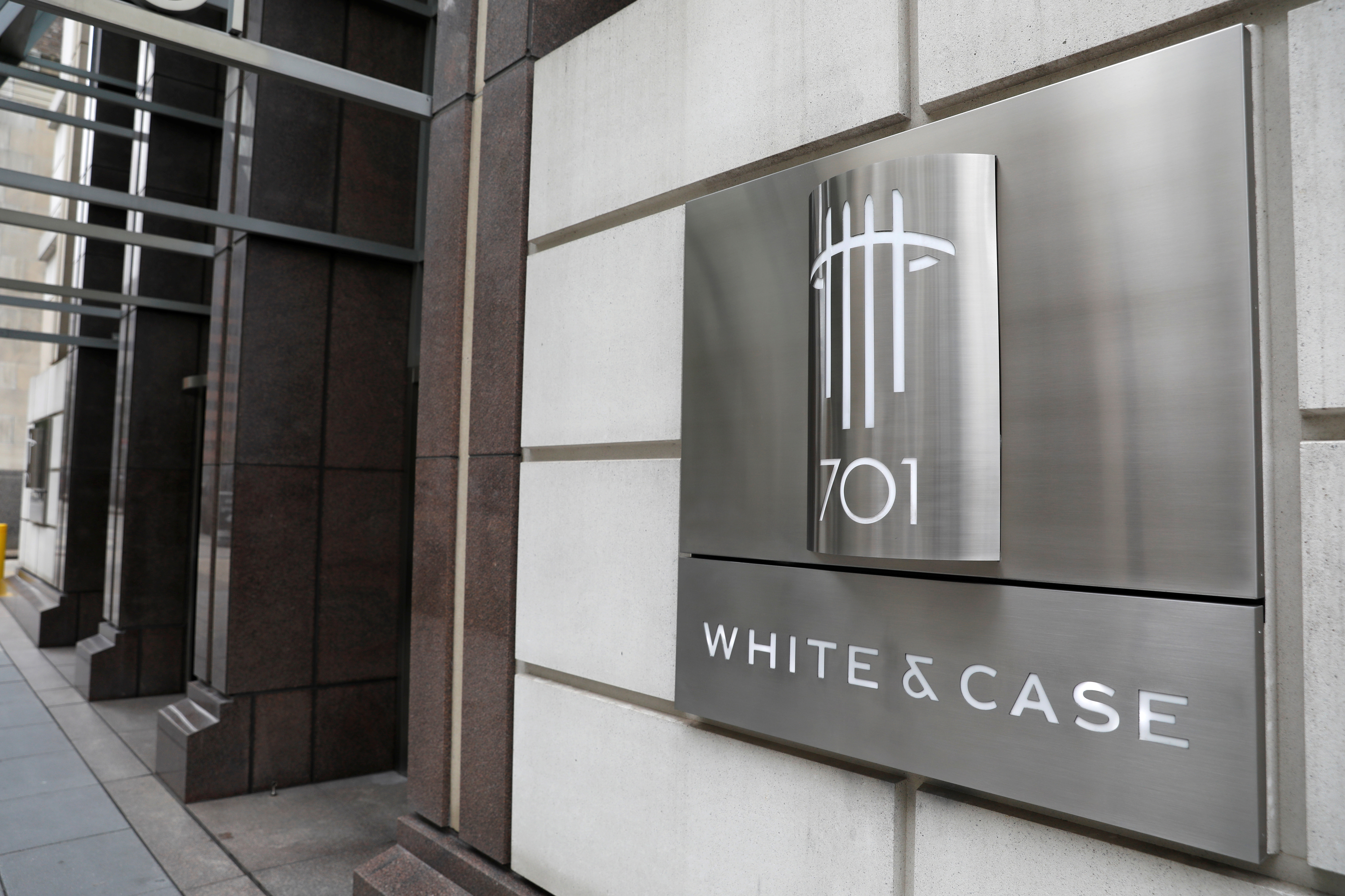 The logo of law firm White & Case LLP is seen outside of their office in Washington, D.C.