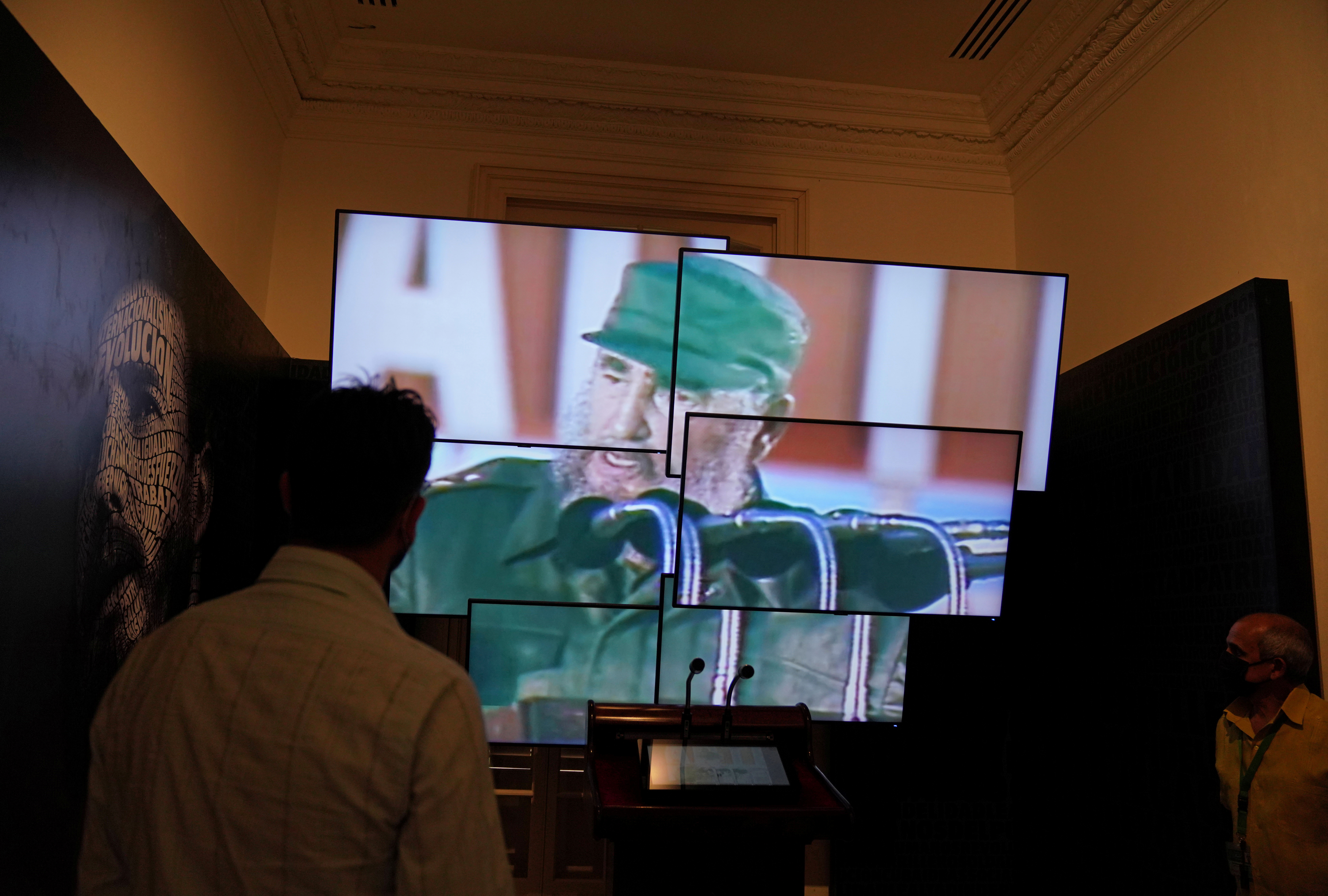 People look at a video display of Cuba's late leader Fidel Castro at the museum 