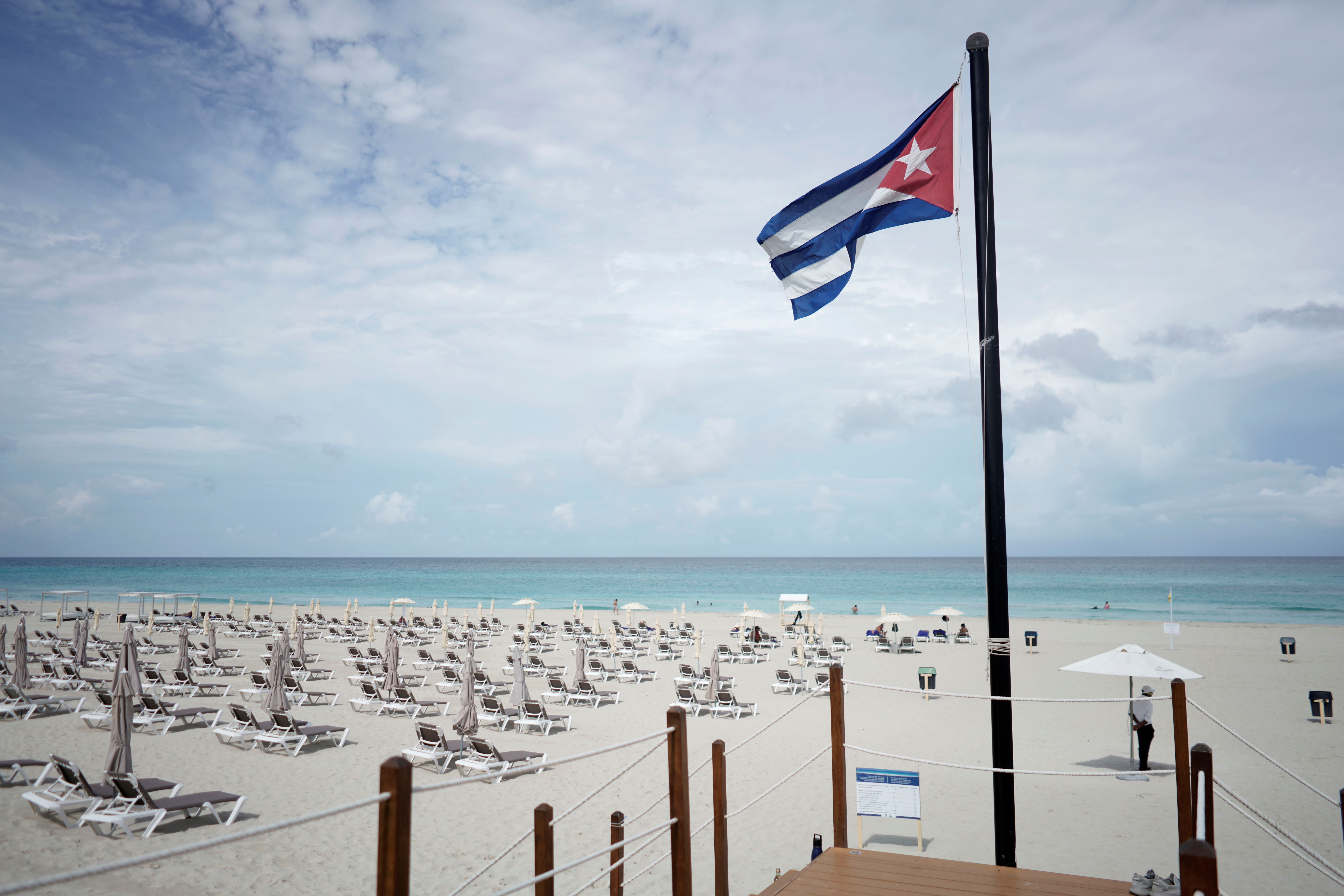 A Cuban flag is seen on the beach amid concerns about the spread of the coronavirus disease (COVID-19) in Varadero, Cuba, October 22, 2021. Picture taken on October 22, 2021. REUTERS/Alexandre Meneghini/File Photo
