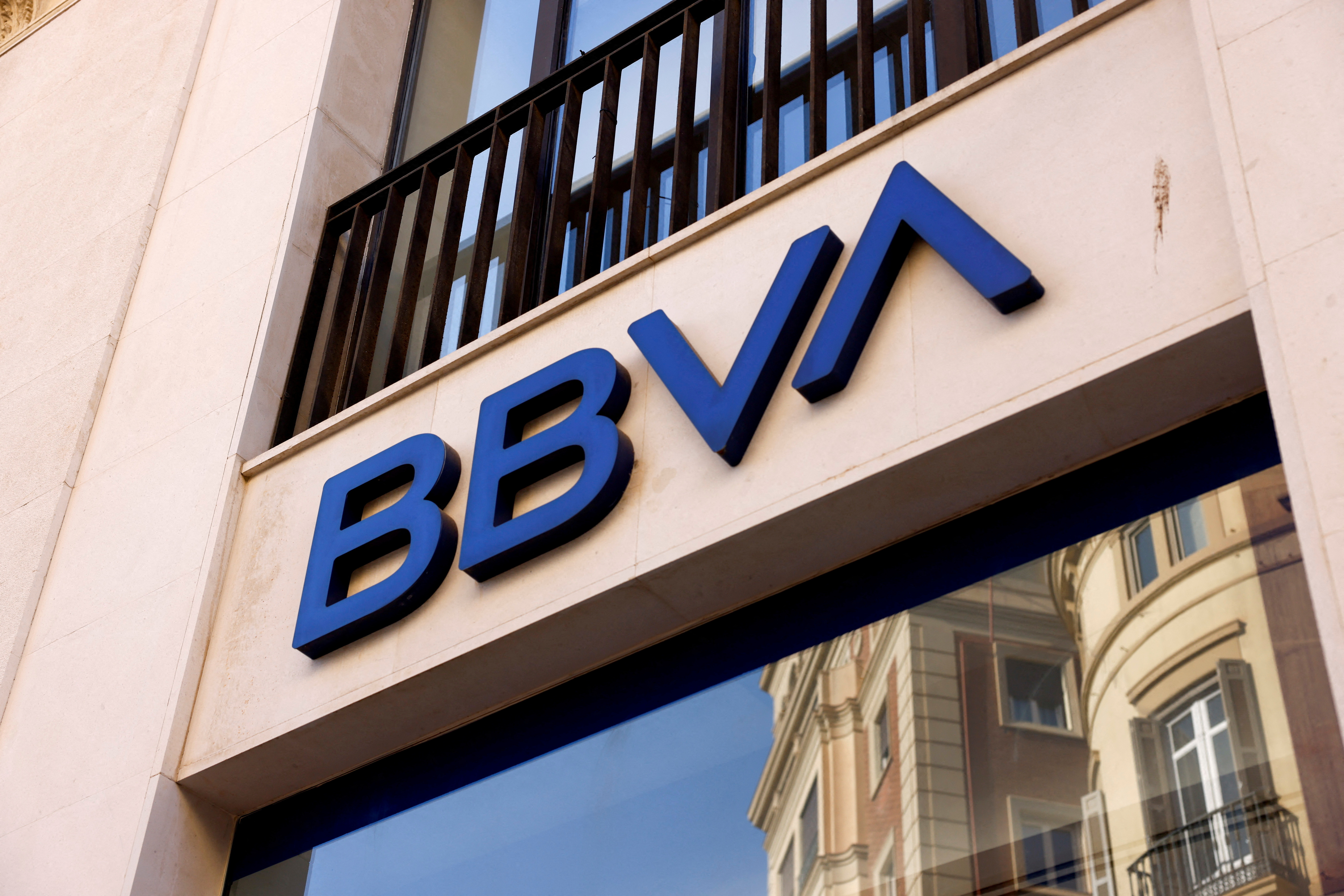 Iconic blue and white BBVA bank branch logo prominently displayed in Malaga, Spain