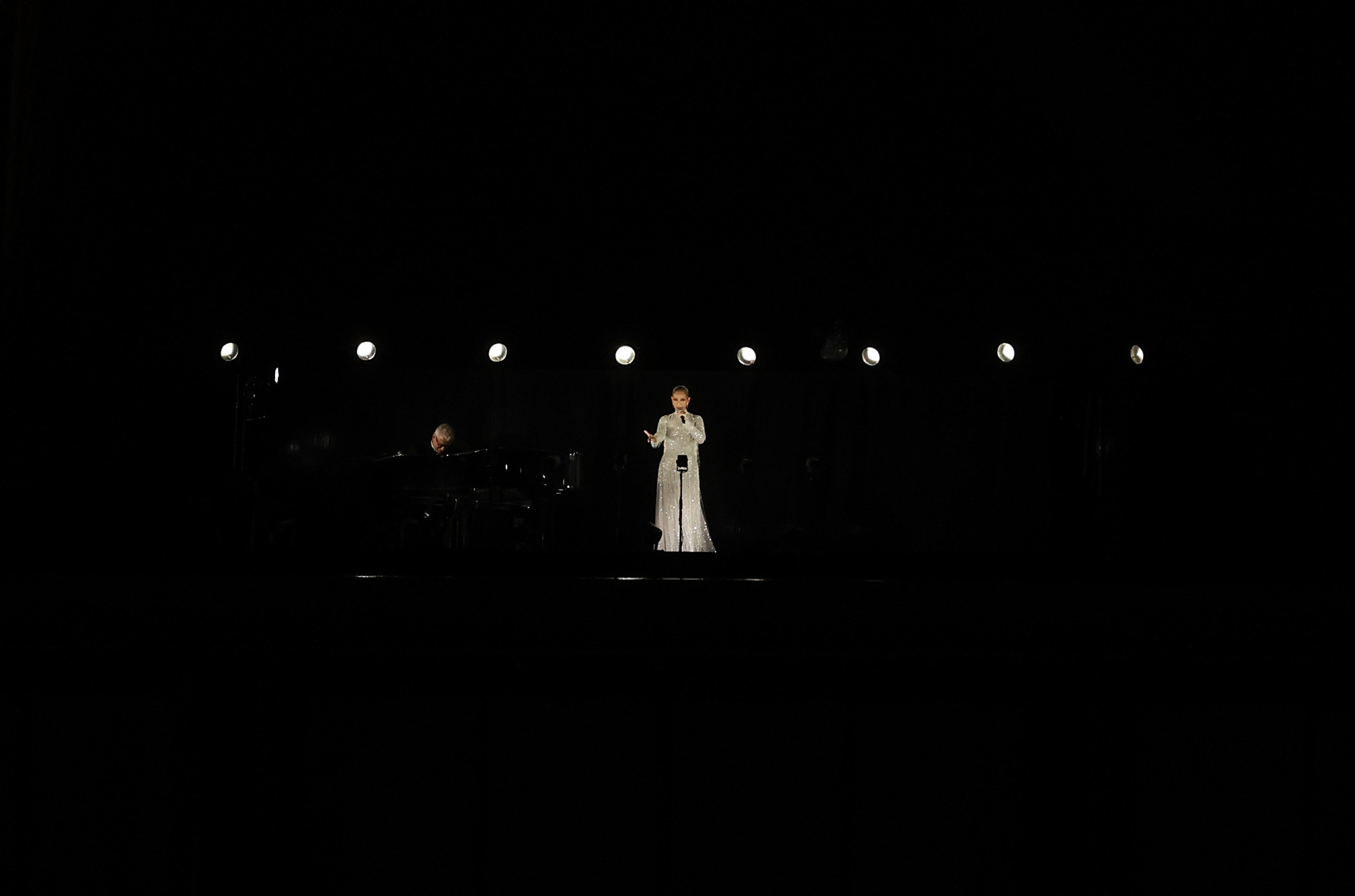 Celine Dion makes return to live stage in Paris opening ceremony Reuters