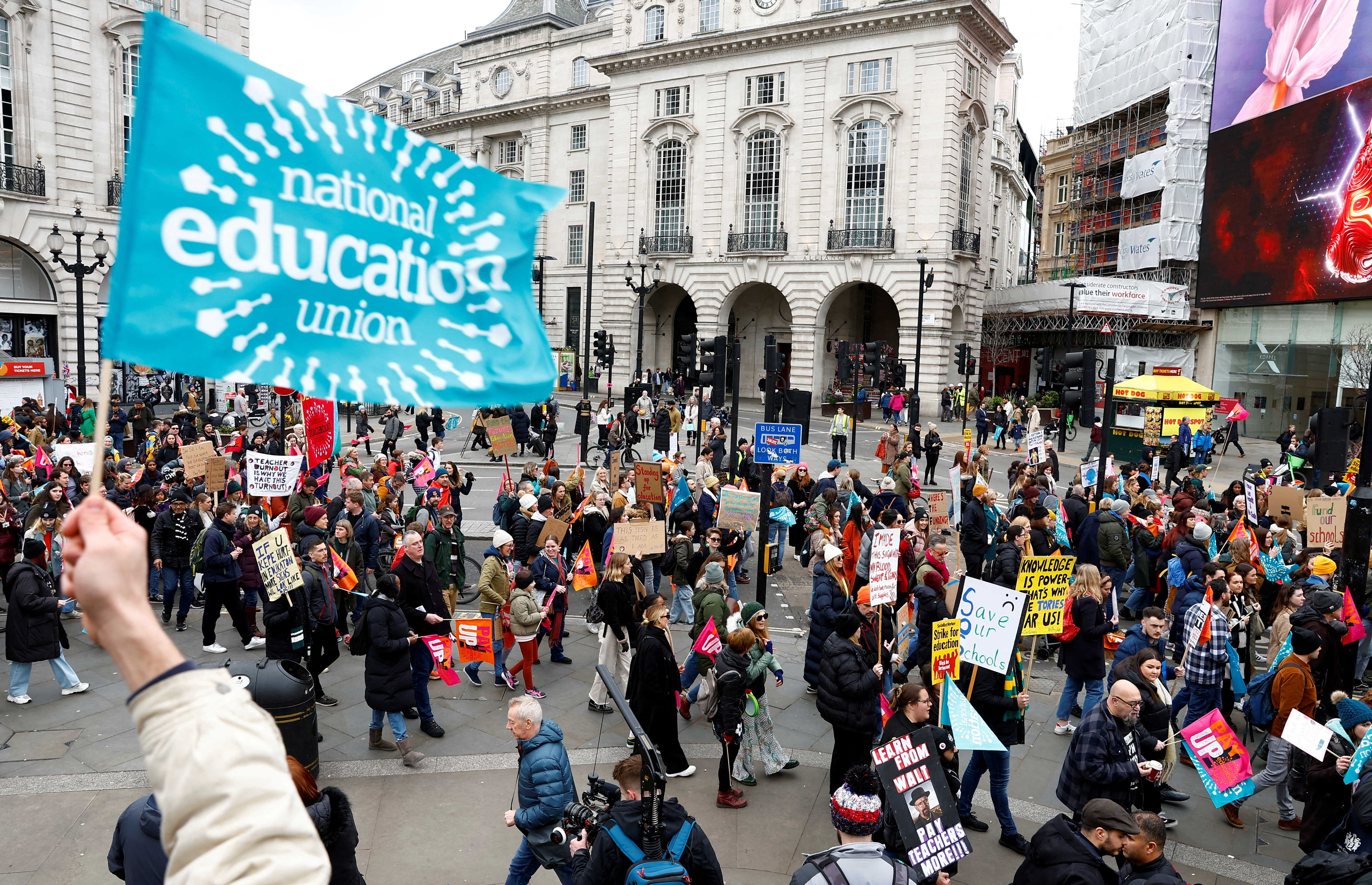 Teachers attend a march during strike action in a dispute over pay, in London