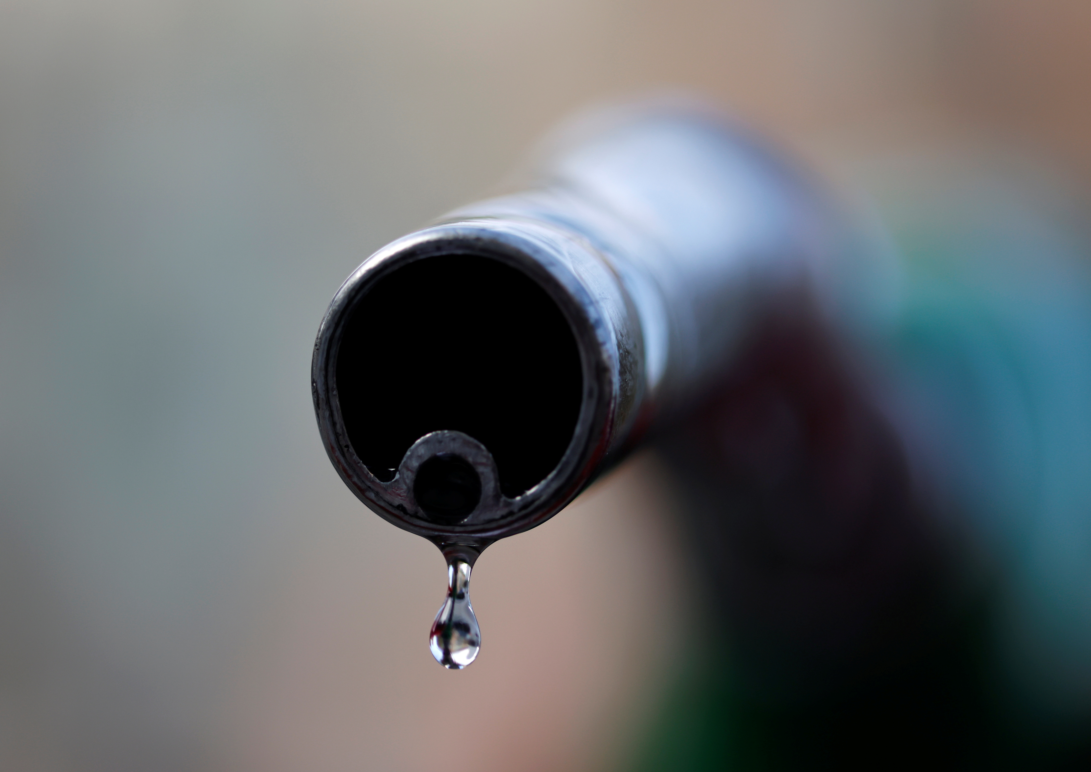 FILE PHOTO - A drop of diesel is seen at the tip of a nozzle in a petrol station in Nice