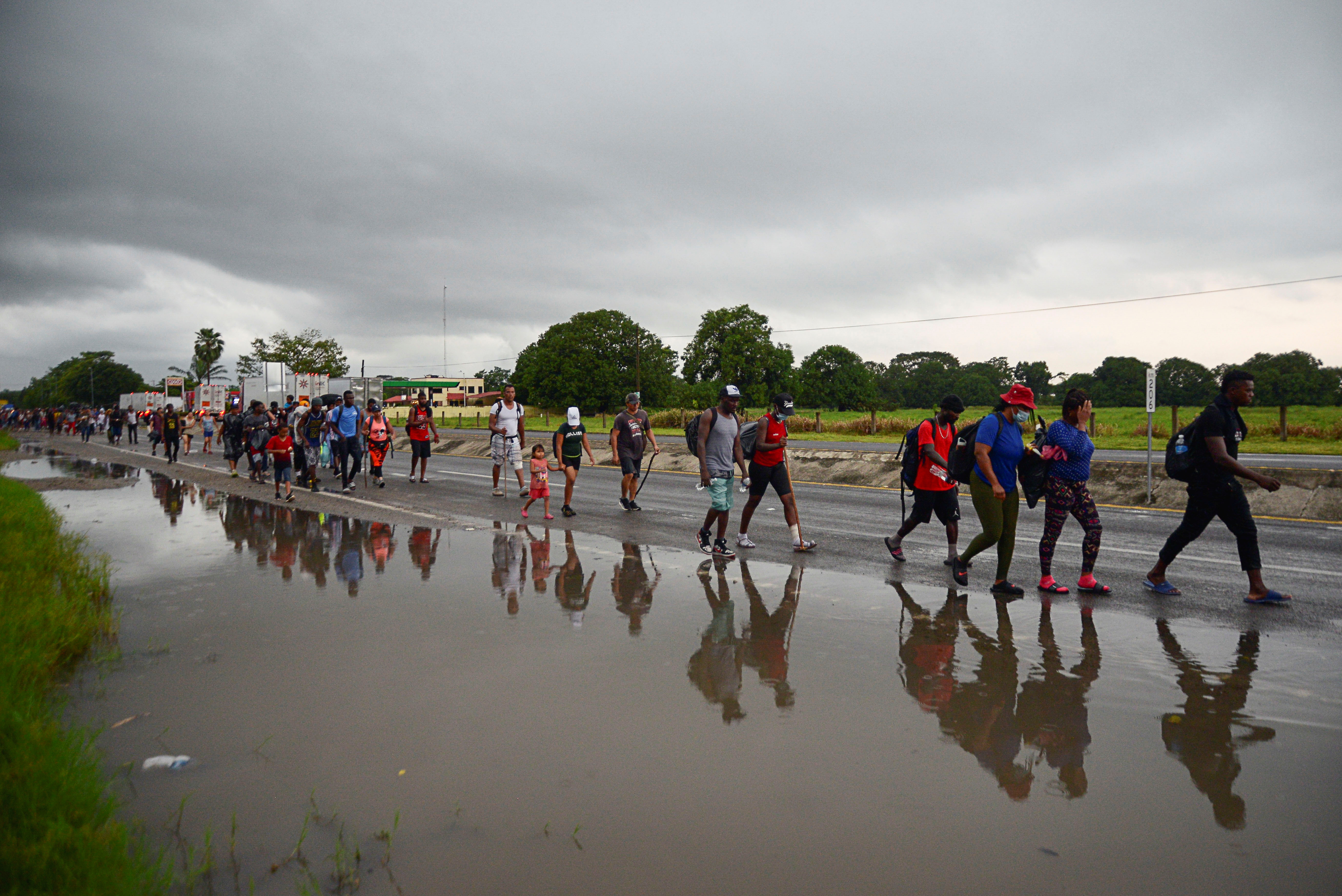 Migrants take part in a caravan toward Mexico's capital, in Escuintla