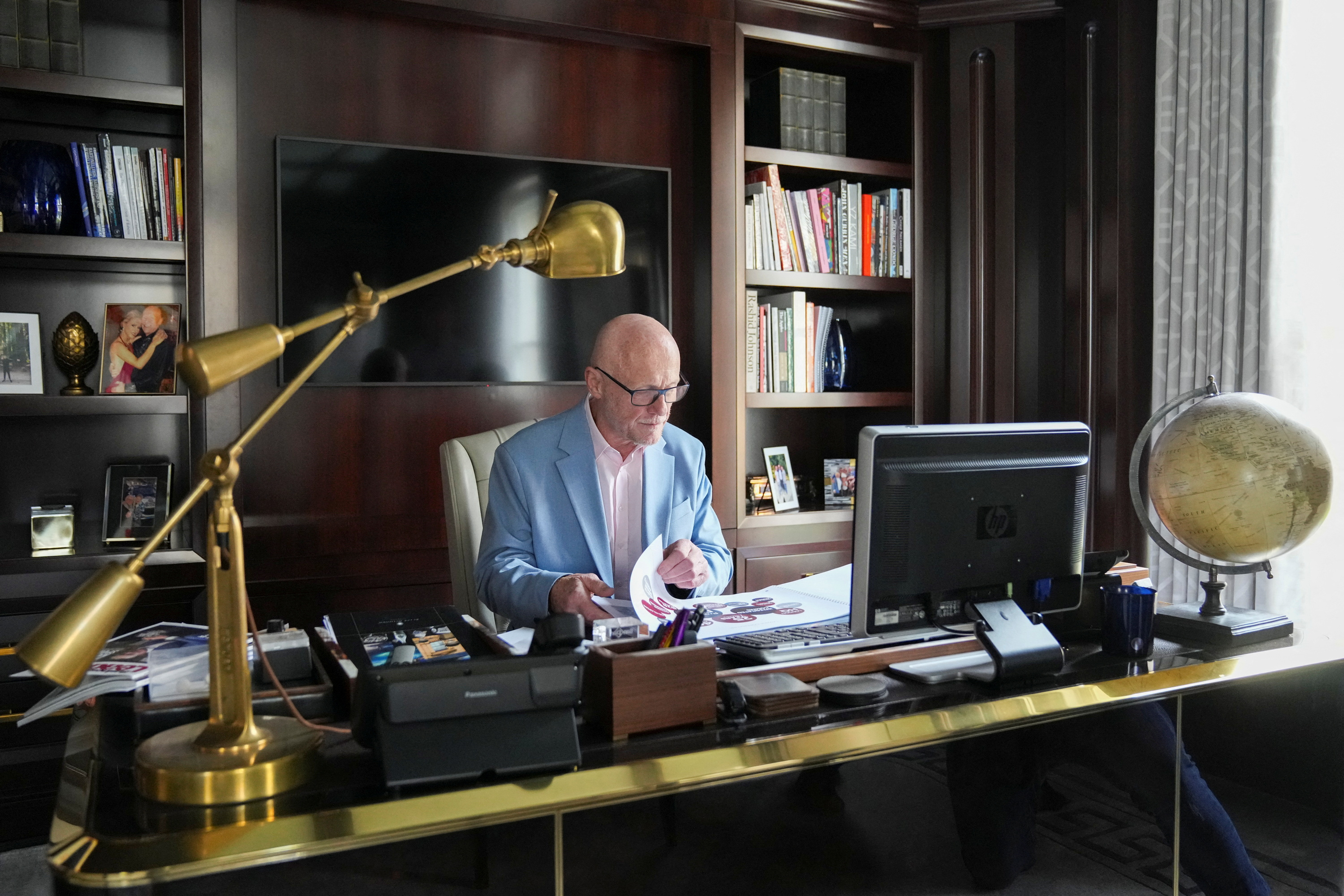 John Caudwell, the billionaire founder of retailer Phones4u, poses for a photograph during an interview with Reuters in London