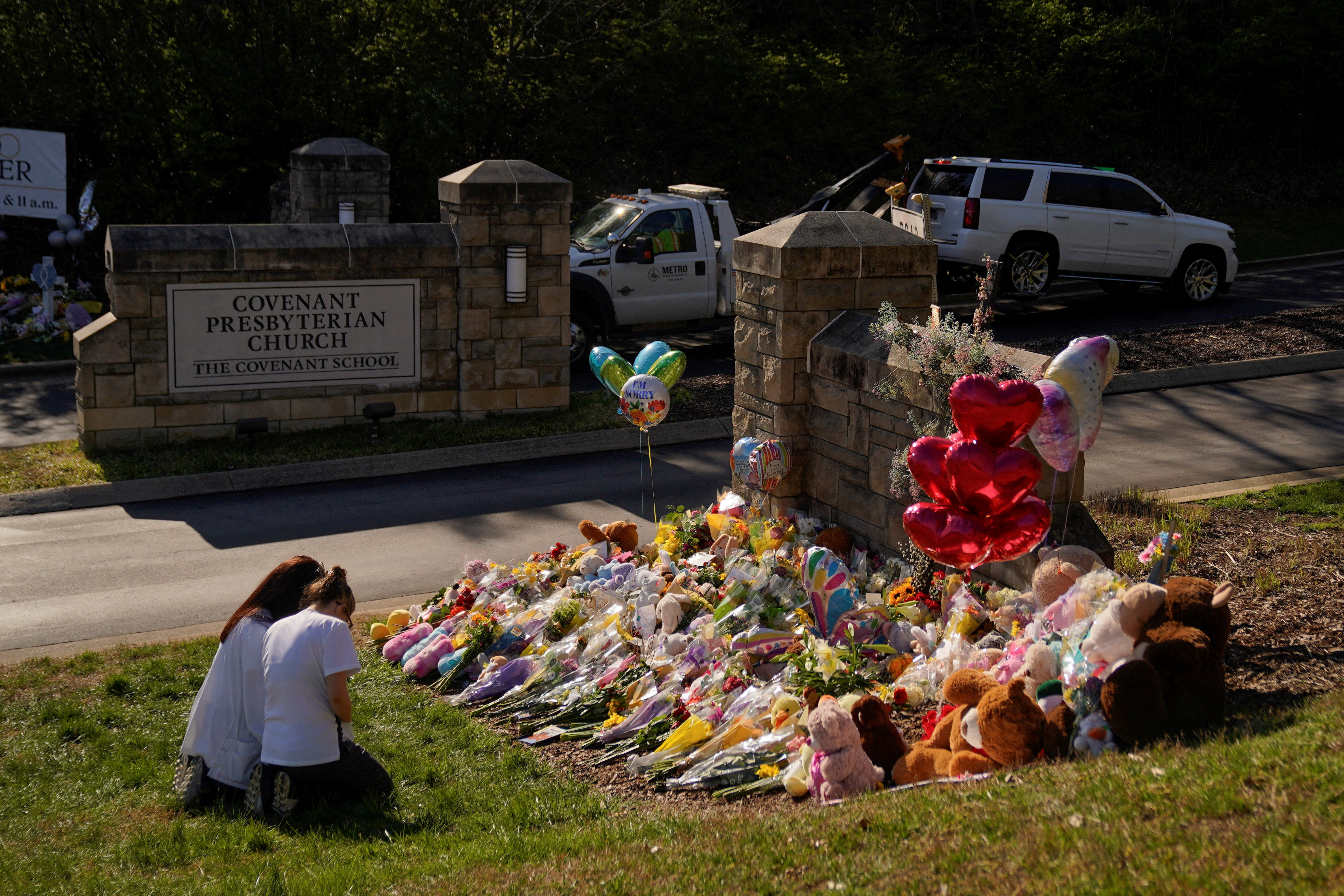 People visit a memorial after deadly shooting at the Covenant School in Nashville