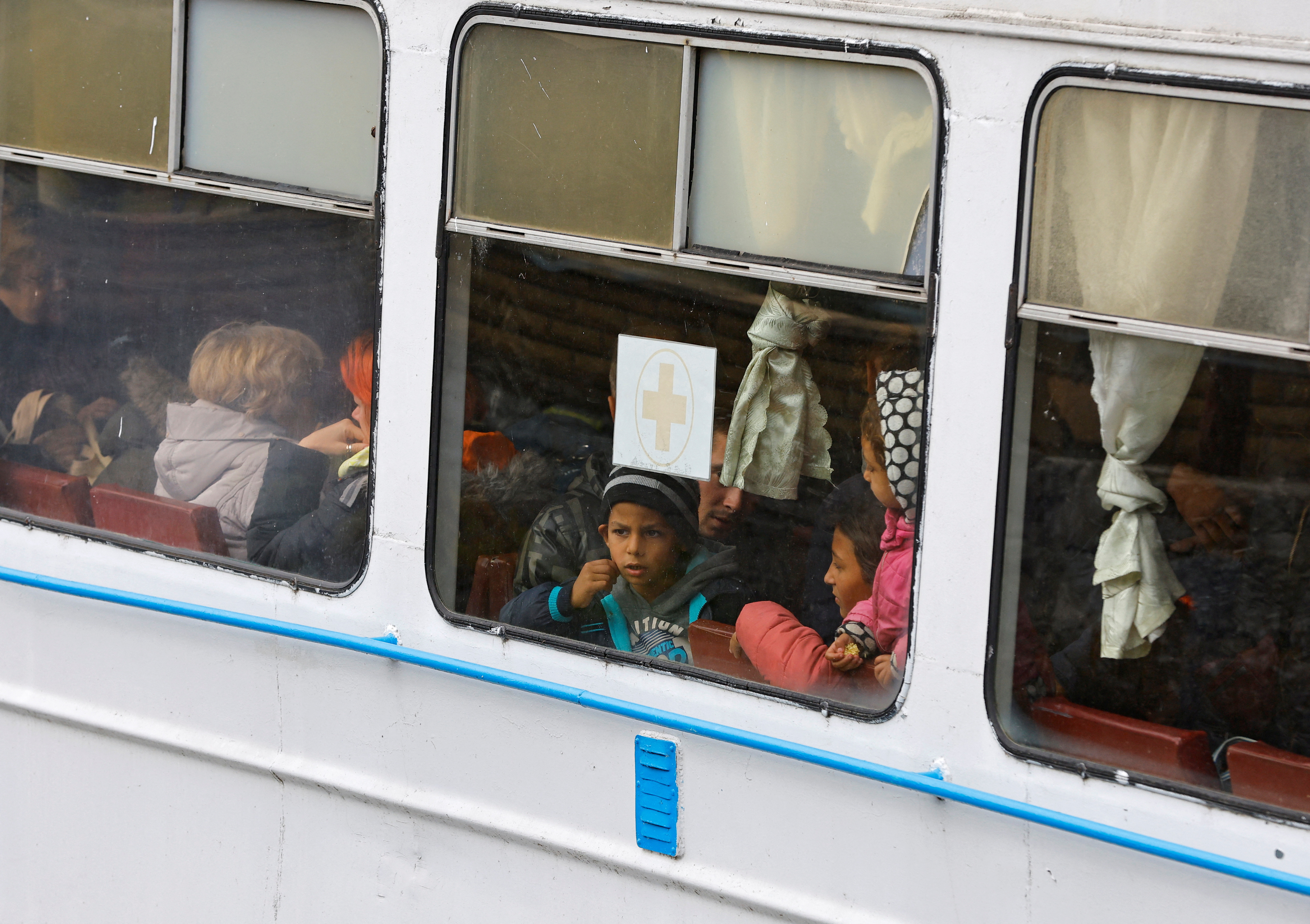 Civilians evacuated from Kherson arrive by ferry in Oleshky