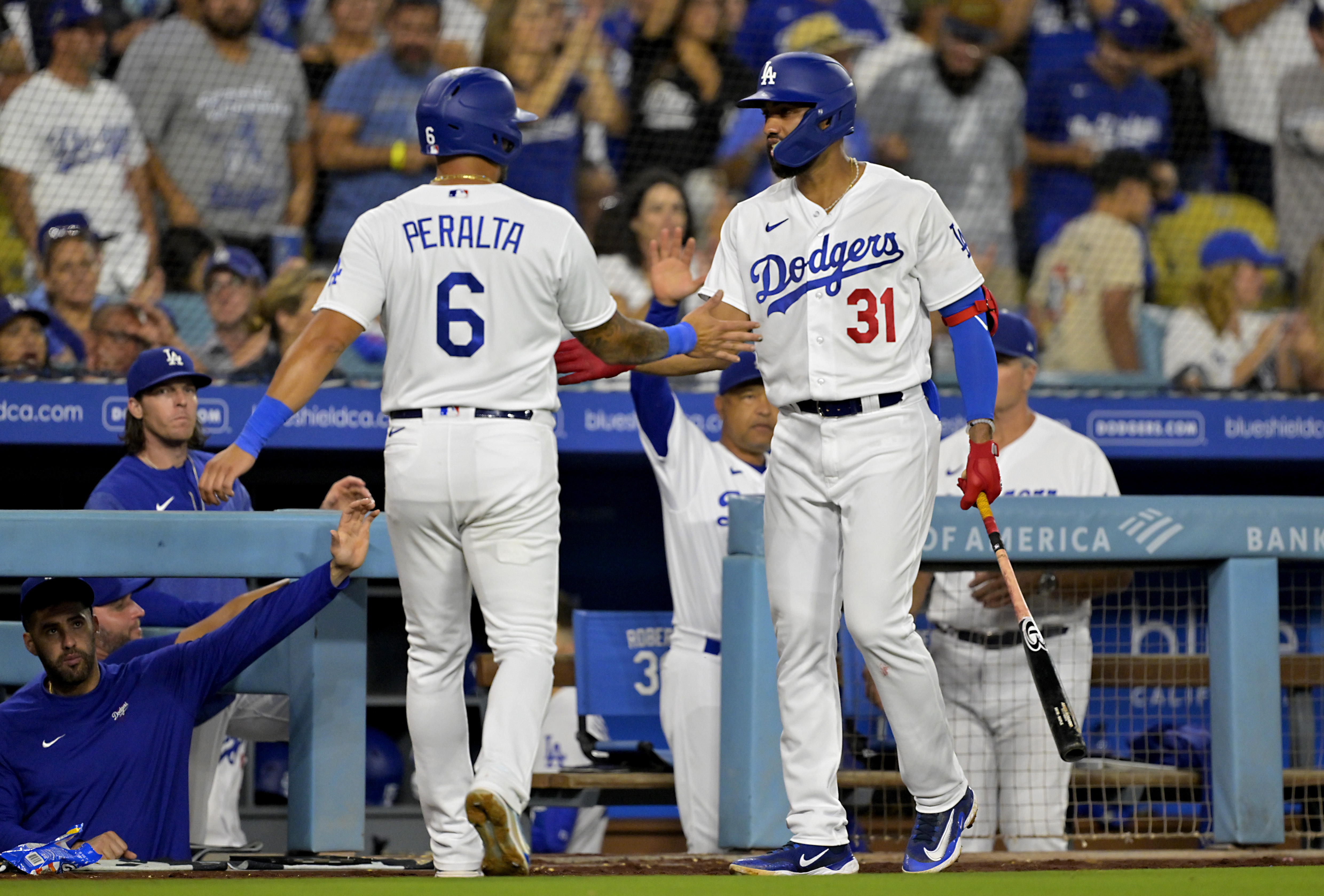 Dodgers use four-run sixth to tame Rockies, 6-1