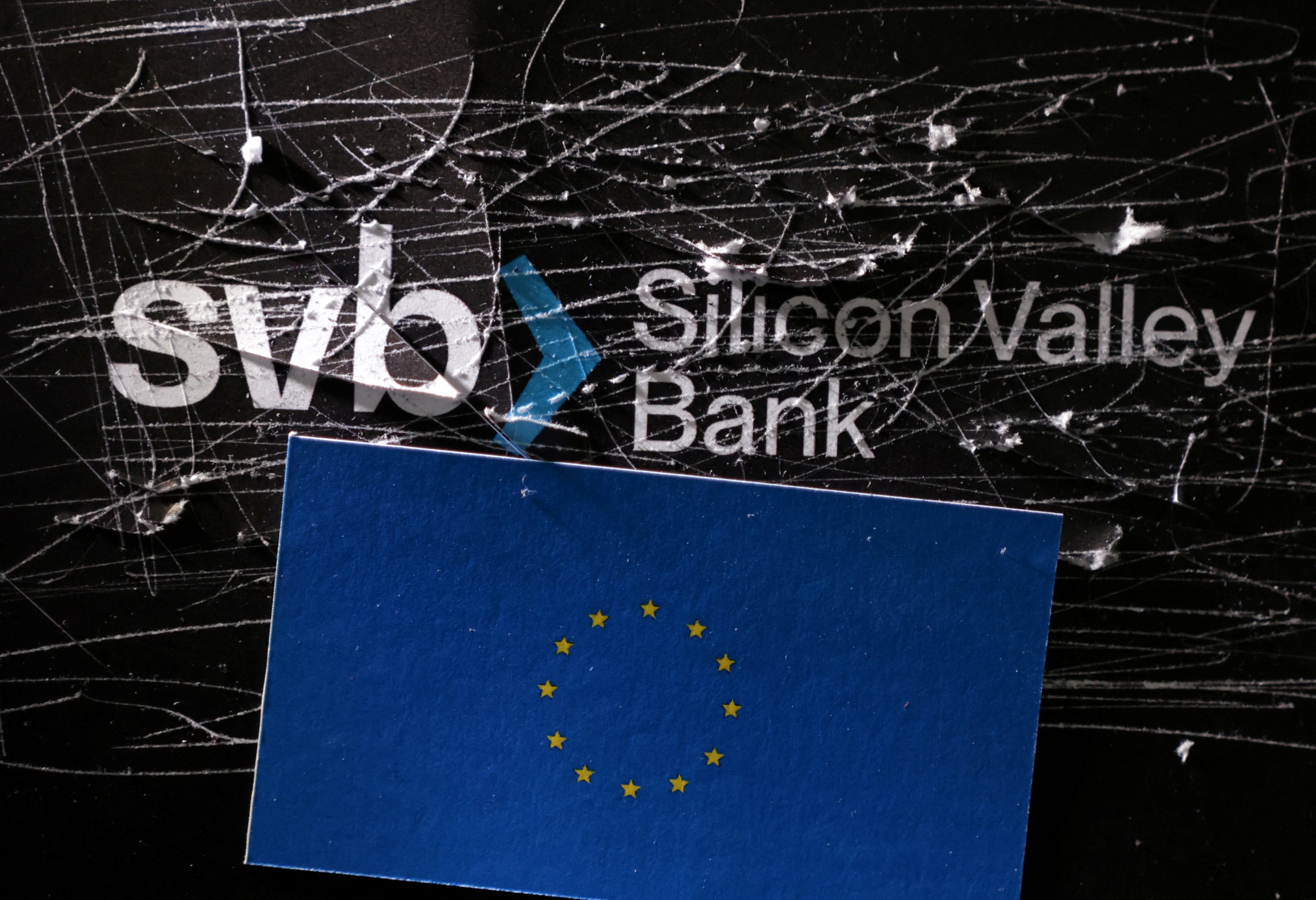 Illustration shows destroyed SVB (Silicon Valley Bank) logo and EU flag