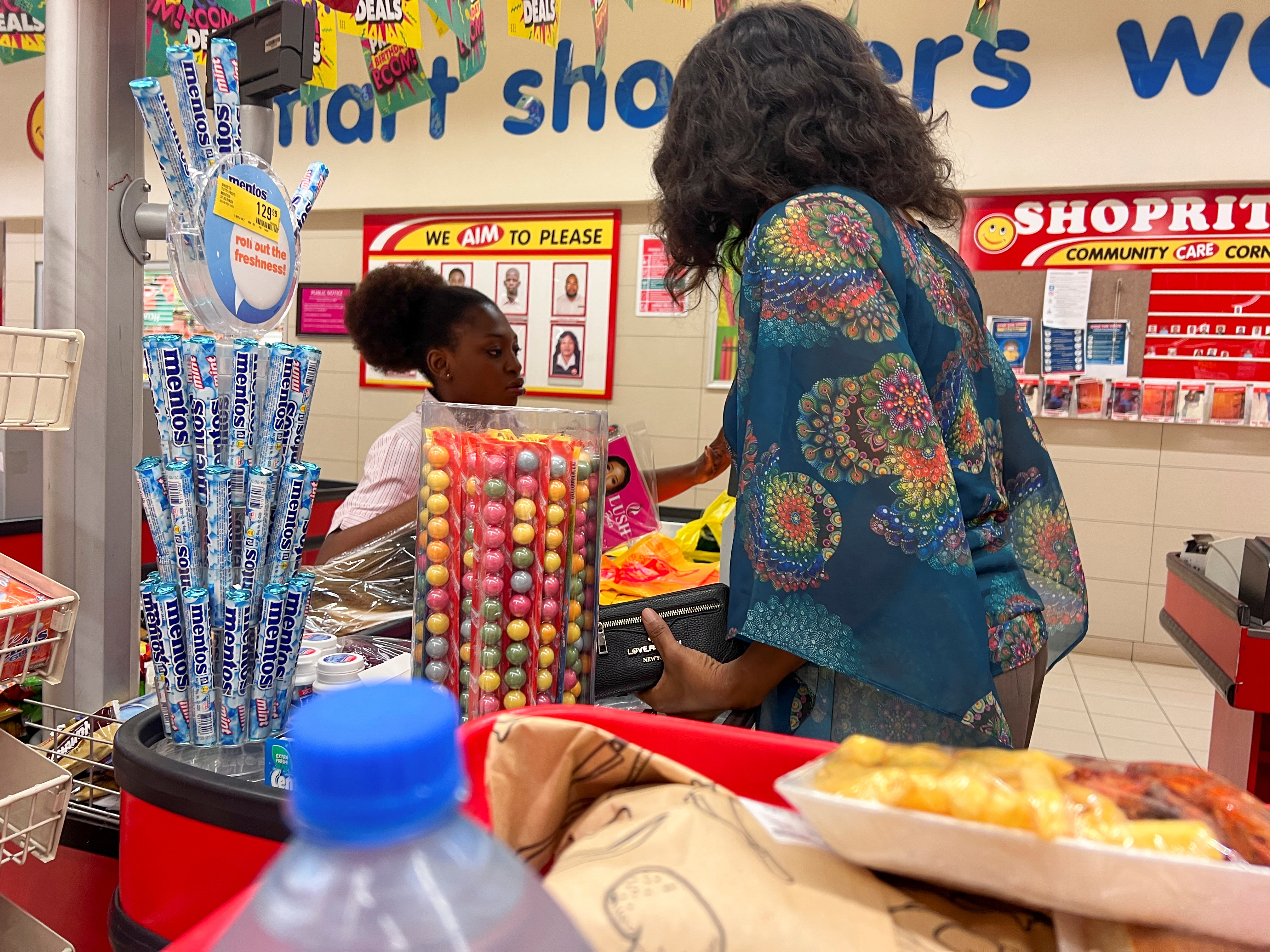 A customer checks out at the cash register in a mall in Abuja