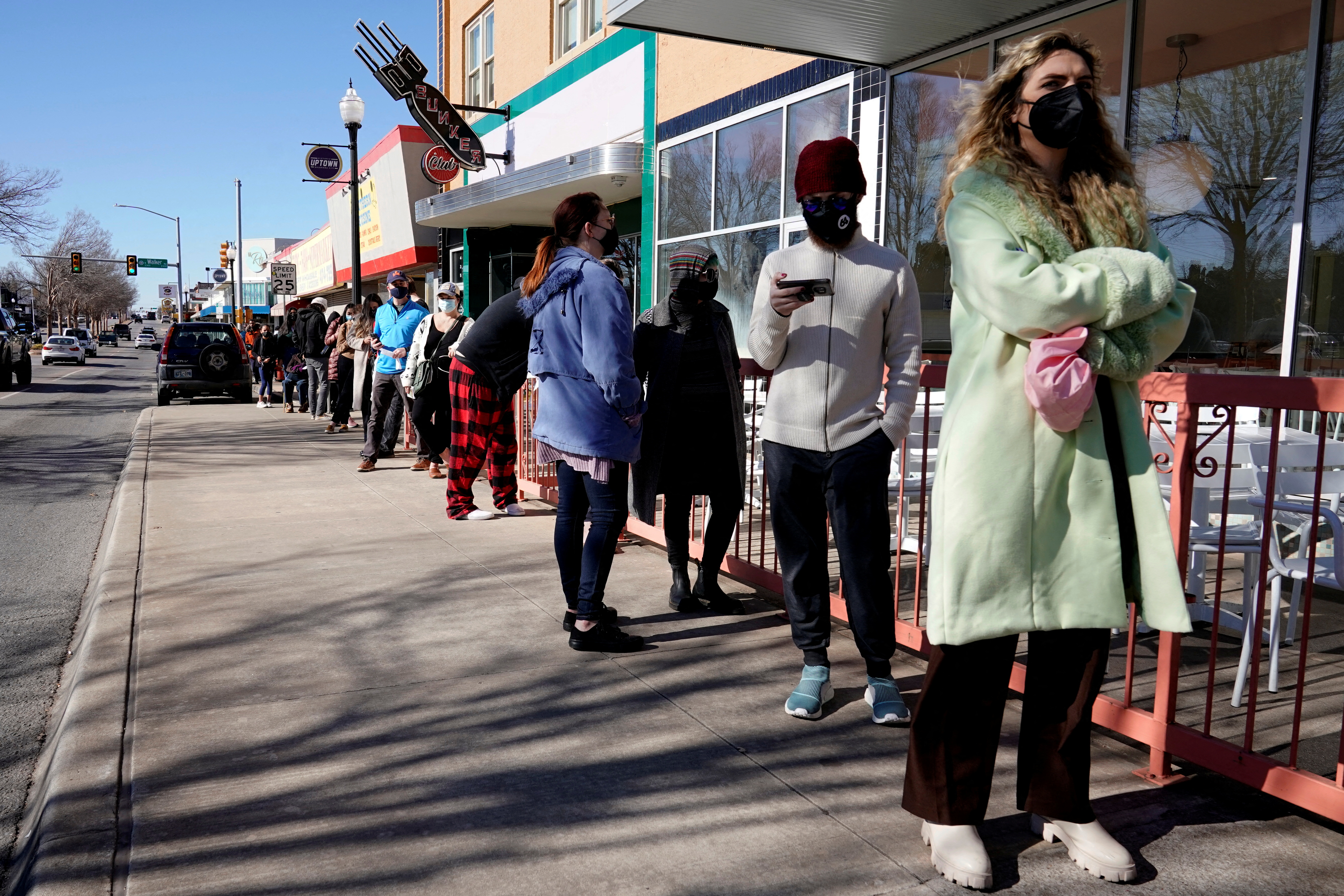 People wait in line to be tested for coronavirus disease (COVID-19) at the Tower Theatre in Oklahoma City, Oklahoma, U.S., January 11, 2022.  REUTERS/Nick Oxford