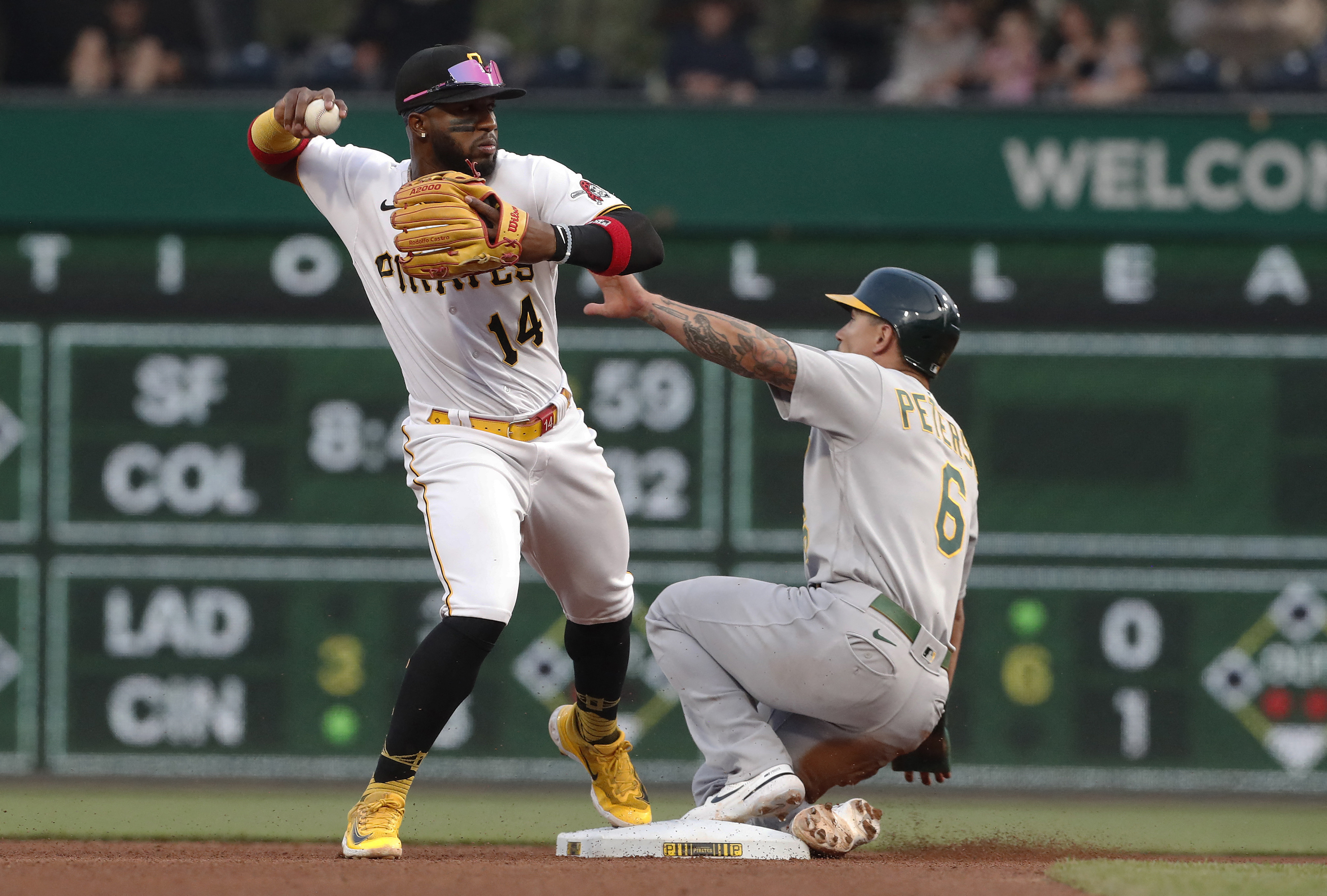 A's sock four homers, batter Pirates to end skid